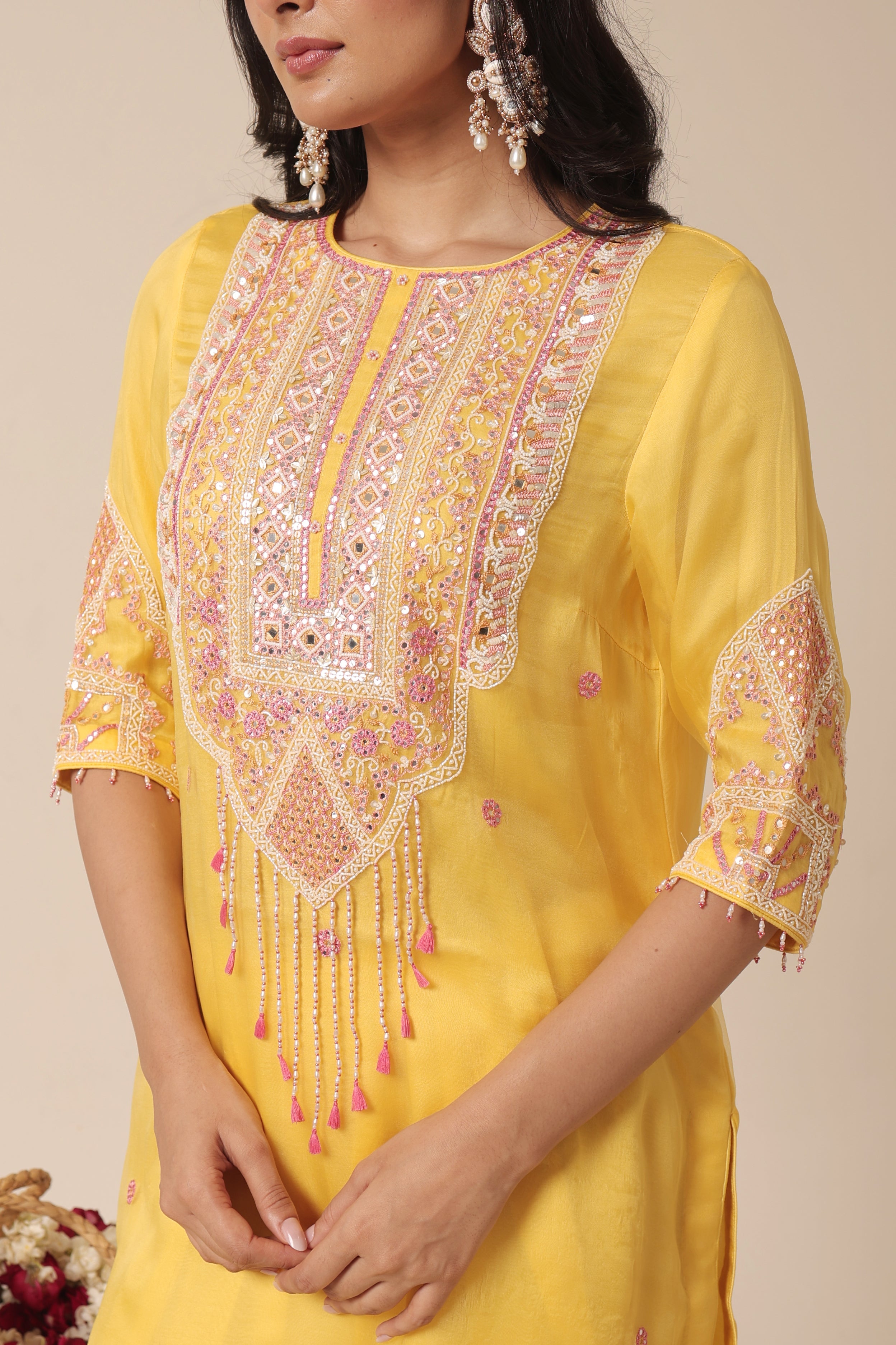 Close-up of mirror embroidery on yellow silk organza kurta – Jhilmil Collection House of AAS.