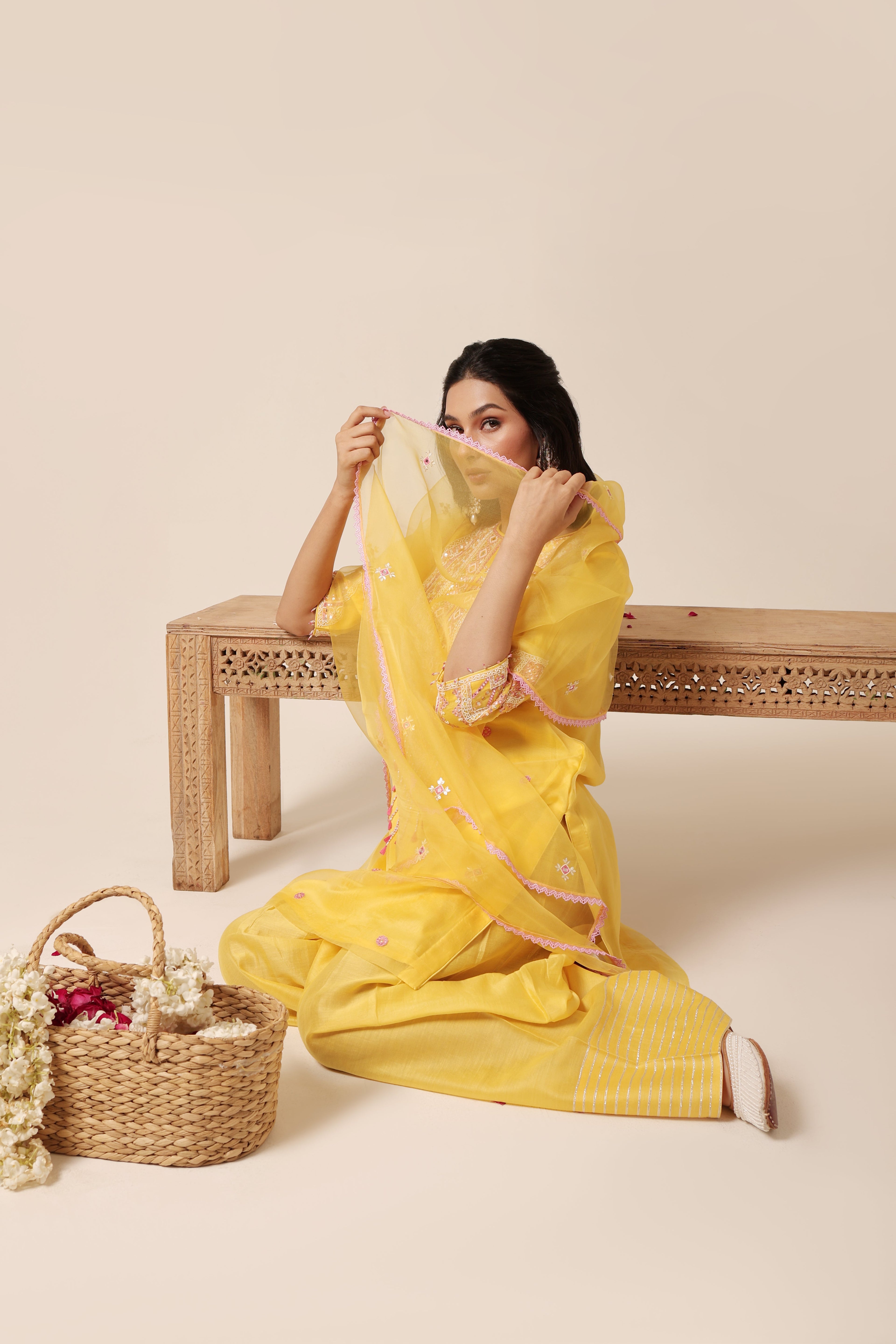 Model wearing yellow silk organza kurta set with mirror embroidery and farshi salwar – Jhilmil Collection House of AAS.