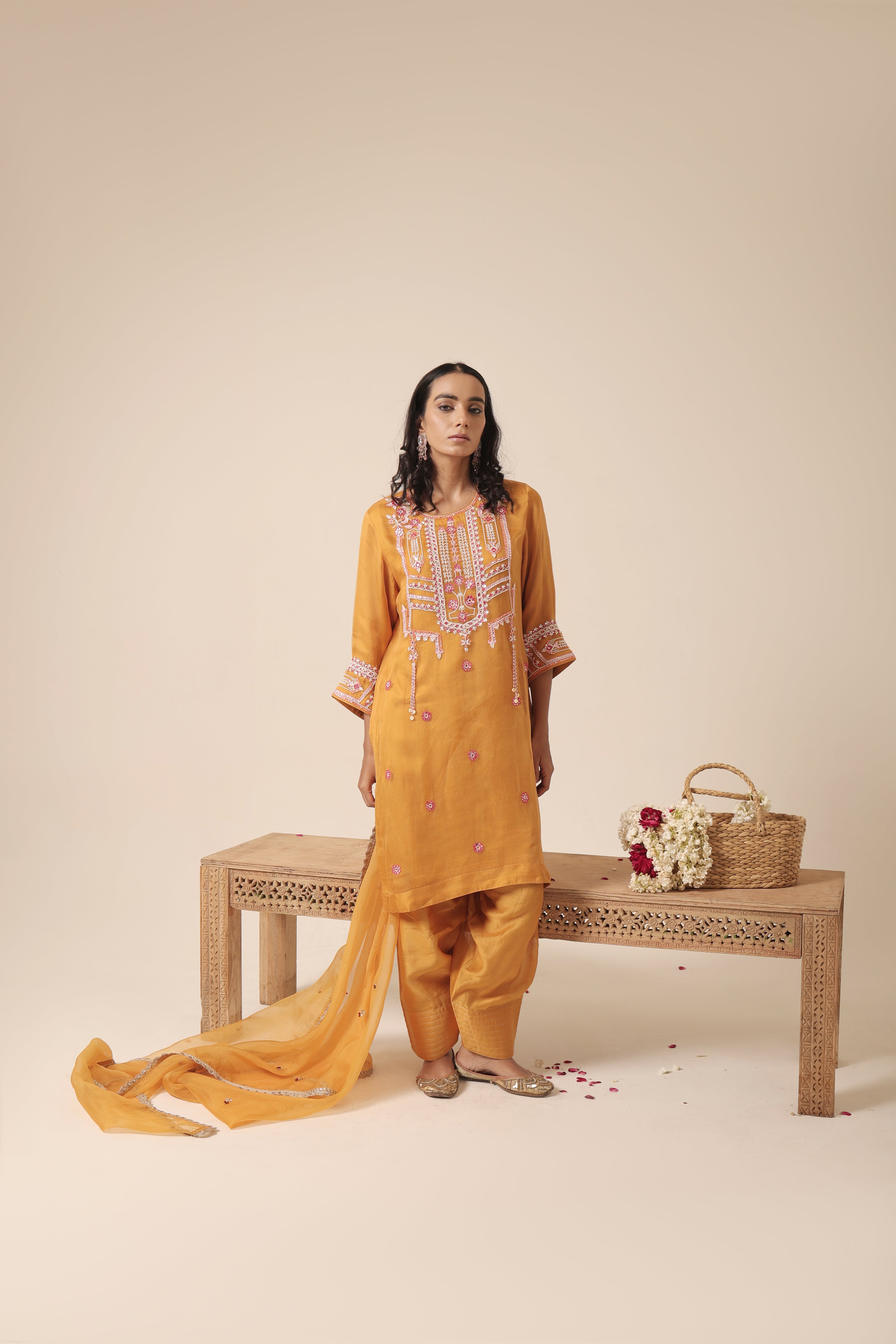 Model wearing mustard organza kurta set with mirror embroidery and farshi salwar – Jhilmil Collection, House of AAS
