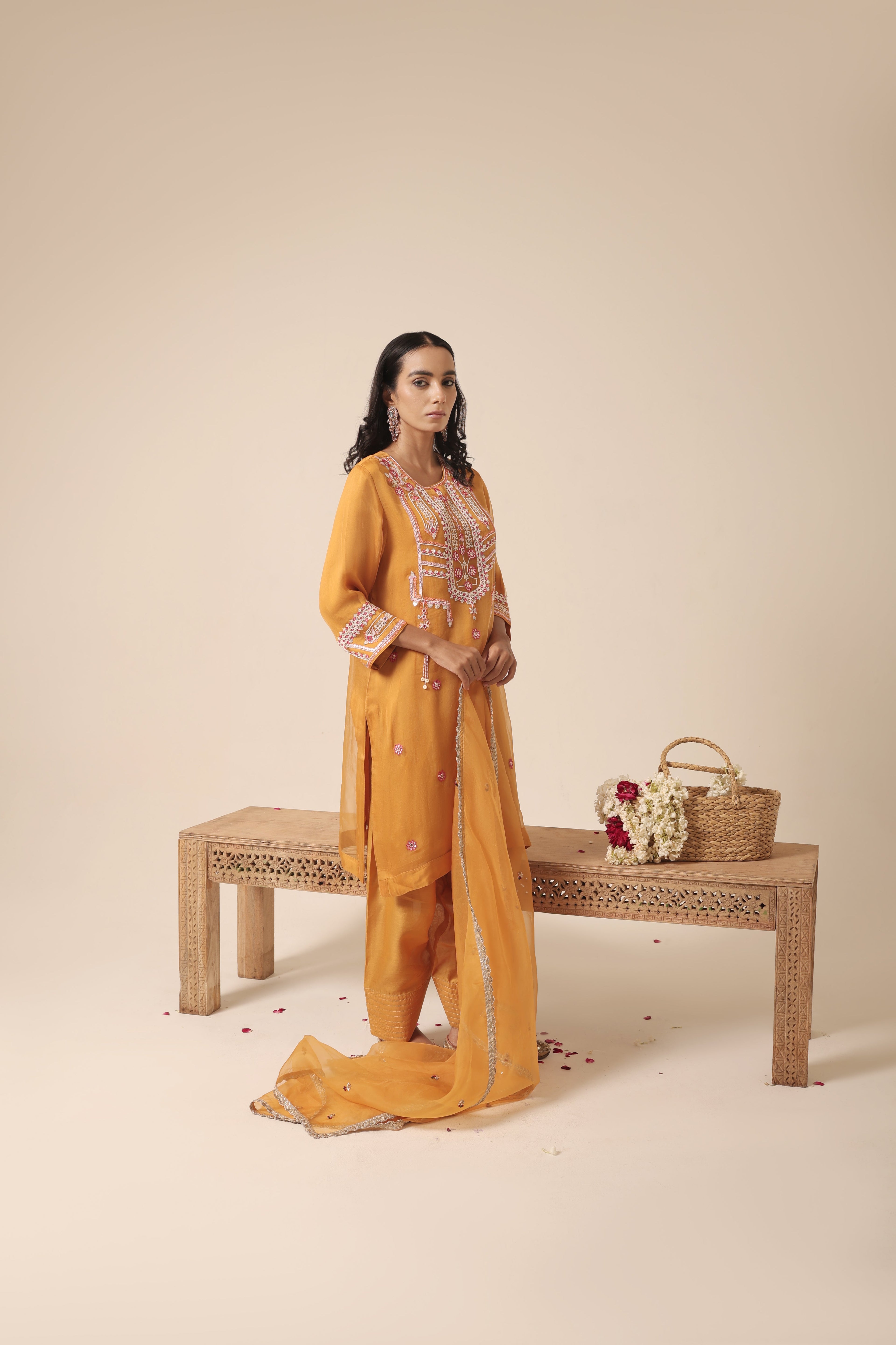 Model wearing mustard organza kurta set with mirror embroidery and farshi salwar – Jhilmil Collection, House of AAS