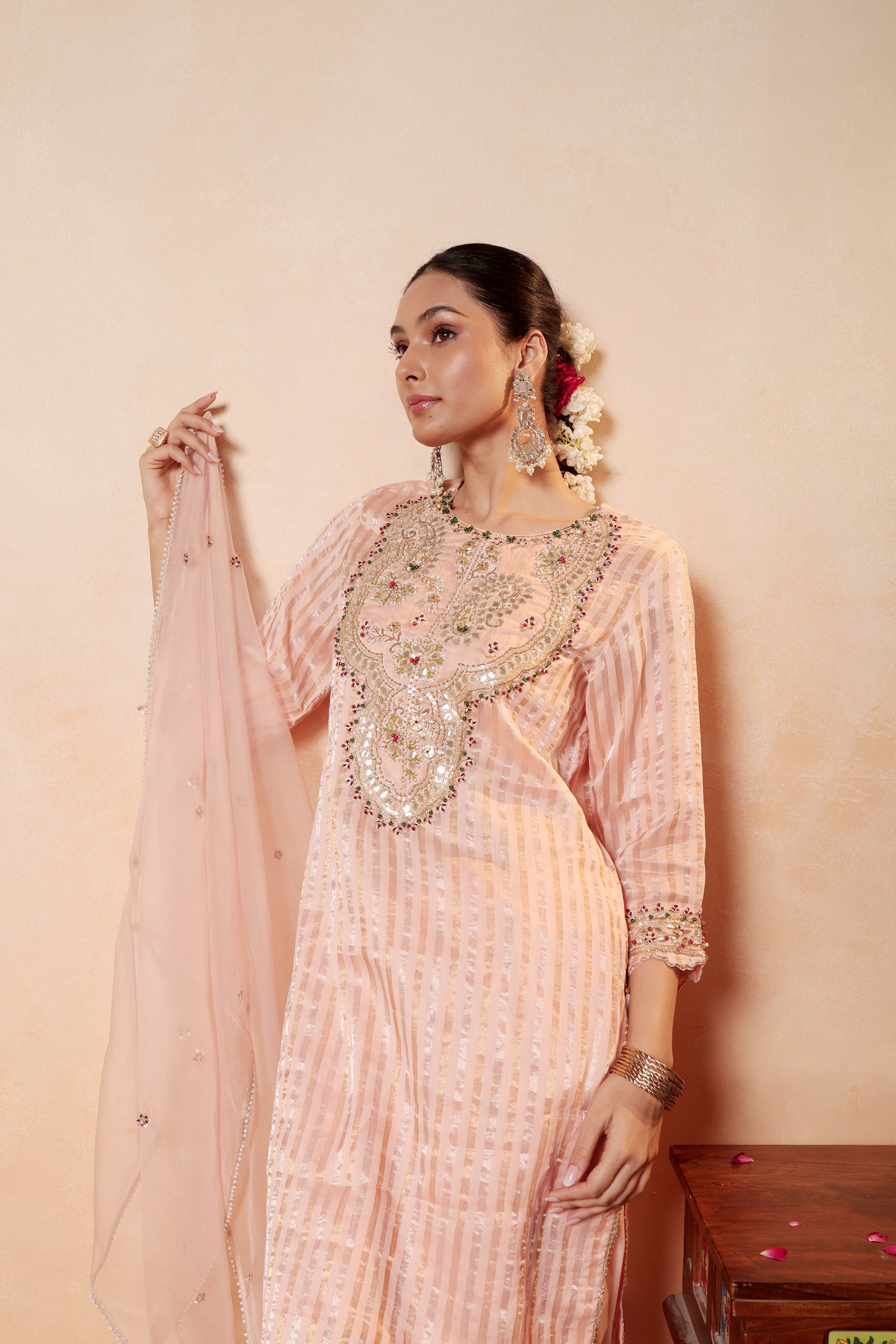 Model wearing peach Tissue Silk Chanderi kurta with gota embroidery, paired with regal farshi salwar and dupatta – Sunehri Gota Collection by House of AAS.