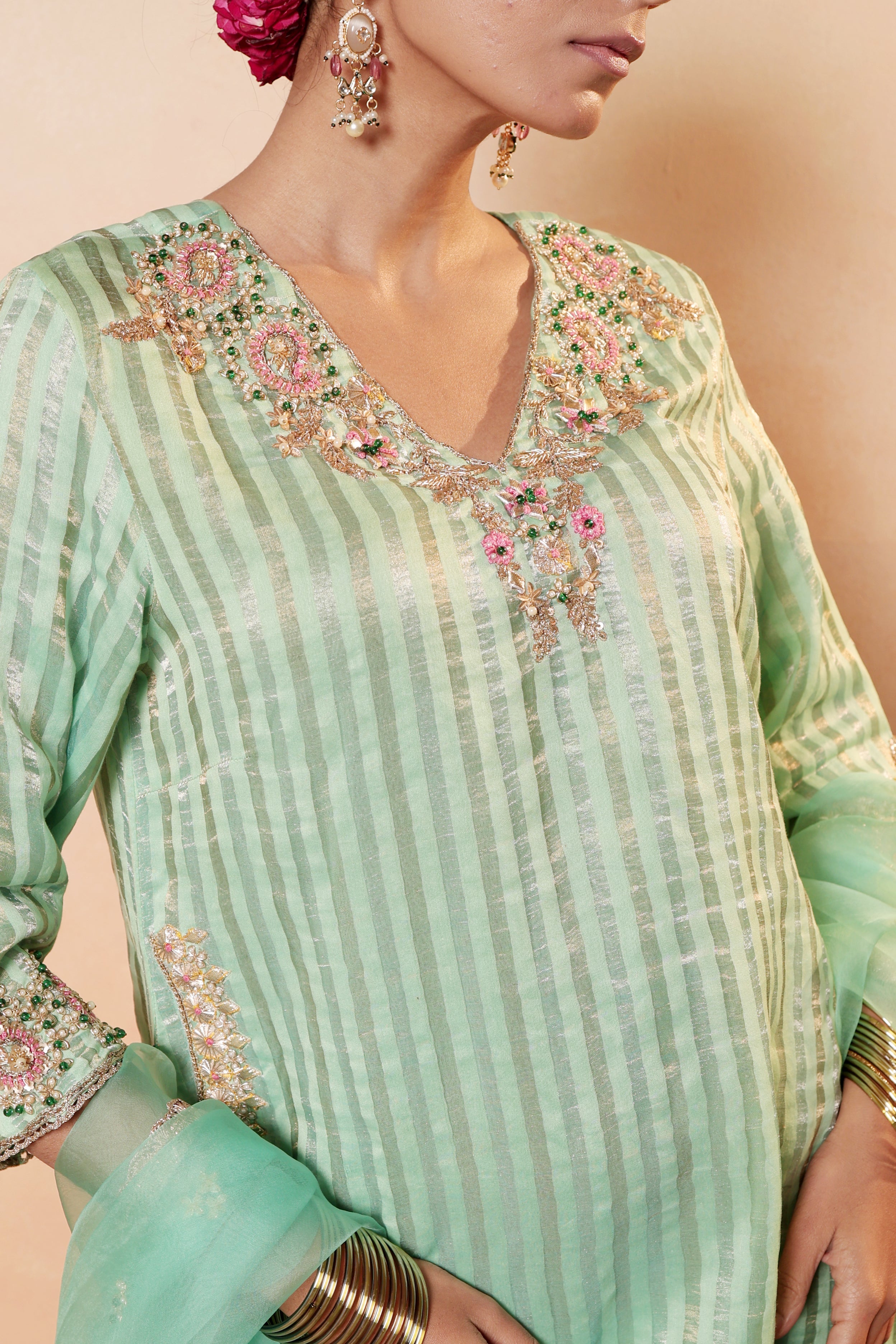 Model wearing mint green silk striper tissue kurta with intricate gota embroidery, paired with regal farshi salwar and dupatta – Sunehri Gota Collection by House of AAS.