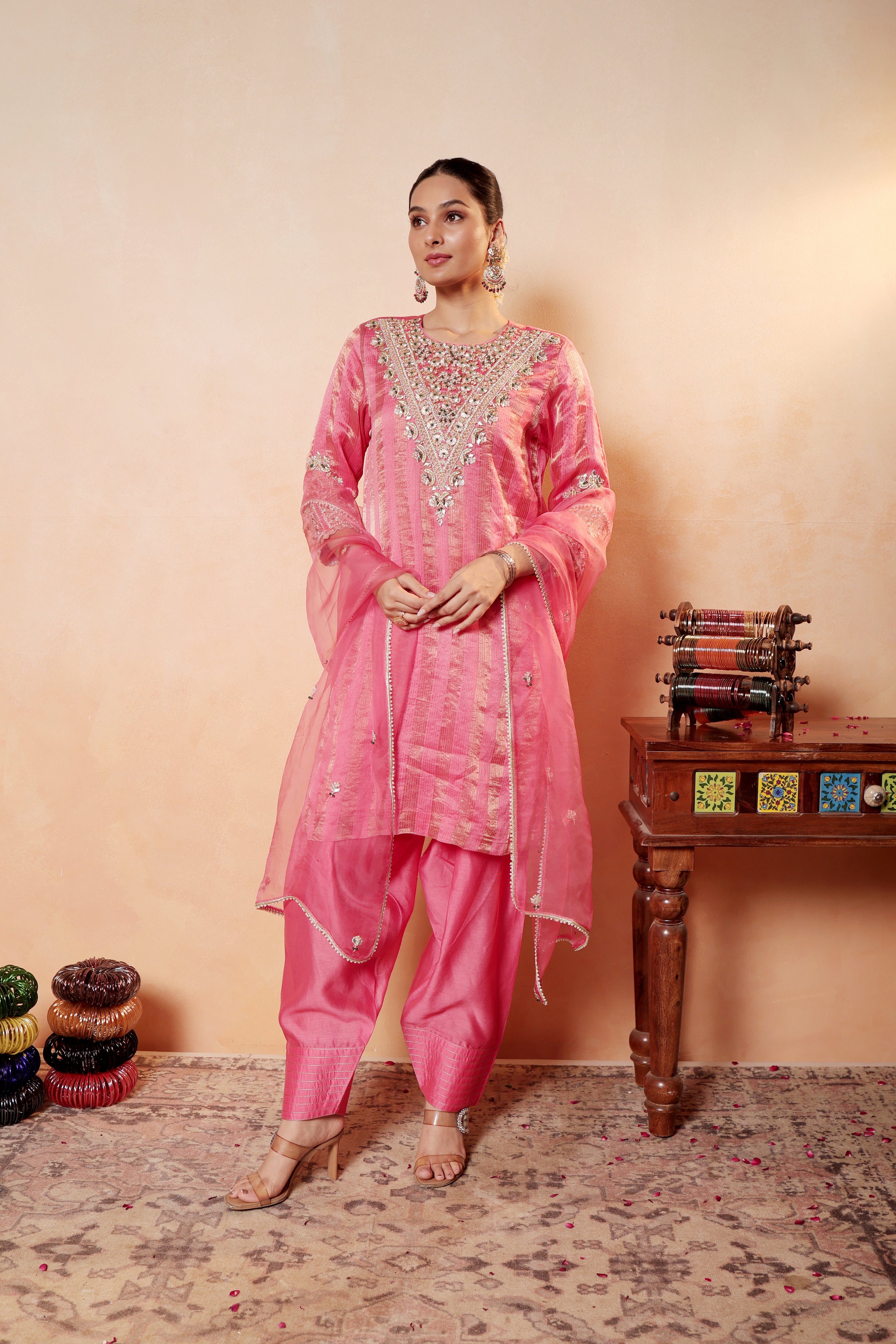 Model wearing pink silk striper tissue kurta with gota embroidery, paired with traditional farshi salwar and dupatta – Sunehri Gota Collection by House of AAS.