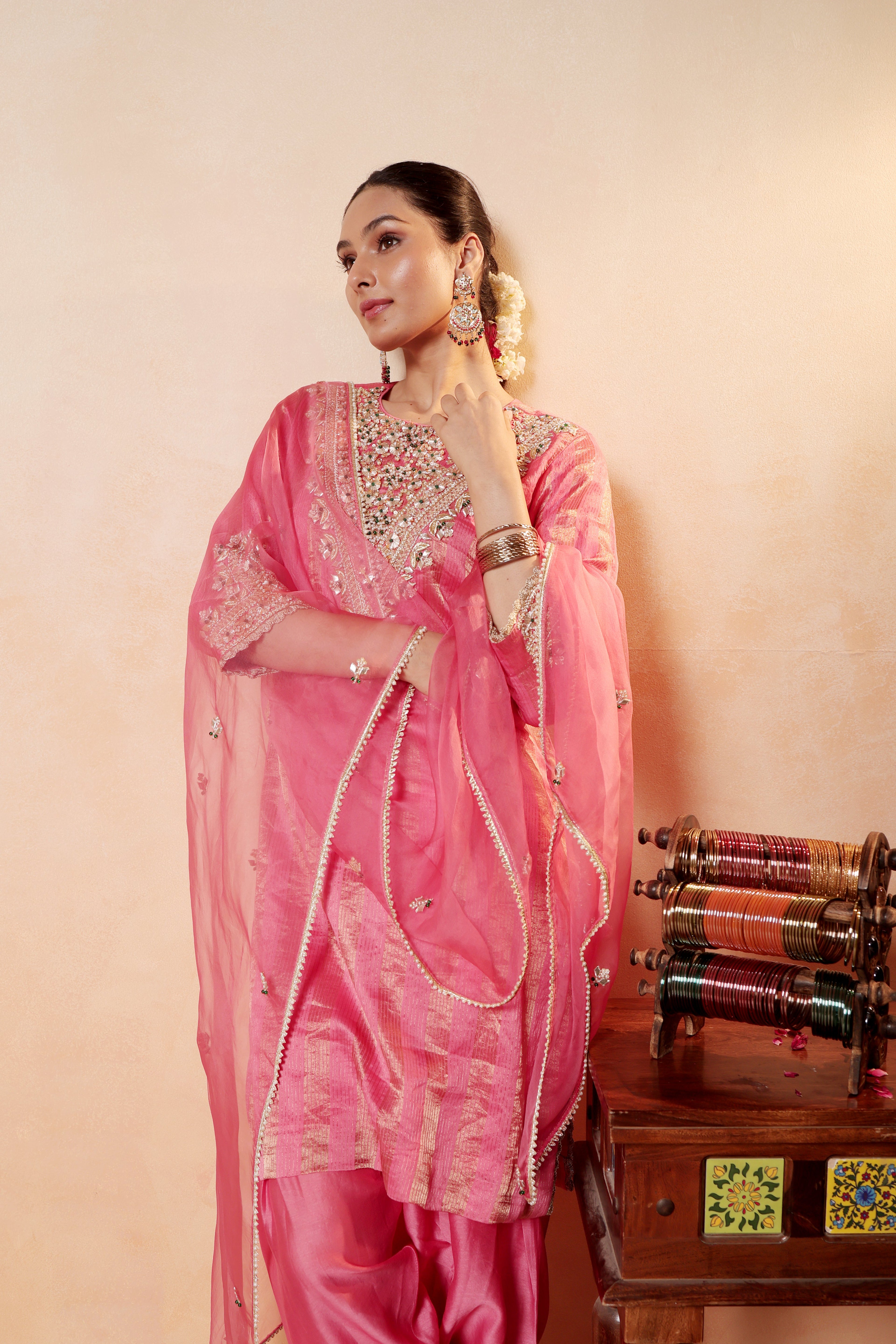 Model wearing pink silk striper tissue kurta with gota embroidery, paired with traditional farshi salwar and dupatta – Sunehri Gota Collection by House of AAS.