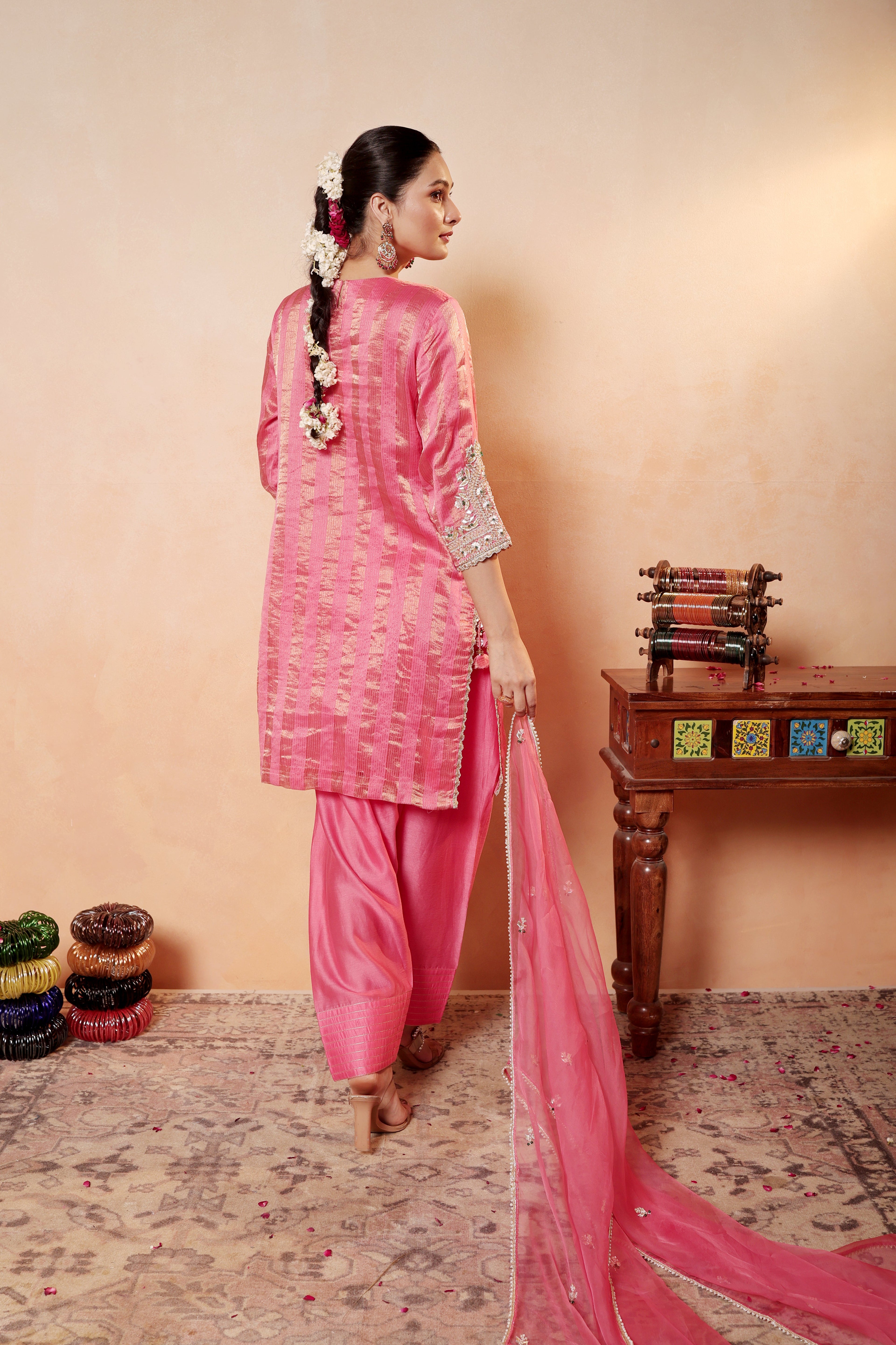 Model wearing pink silk striper tissue kurta with gota embroidery, paired with traditional farshi salwar and dupatta – Sunehri Gota Collection by House of AAS.