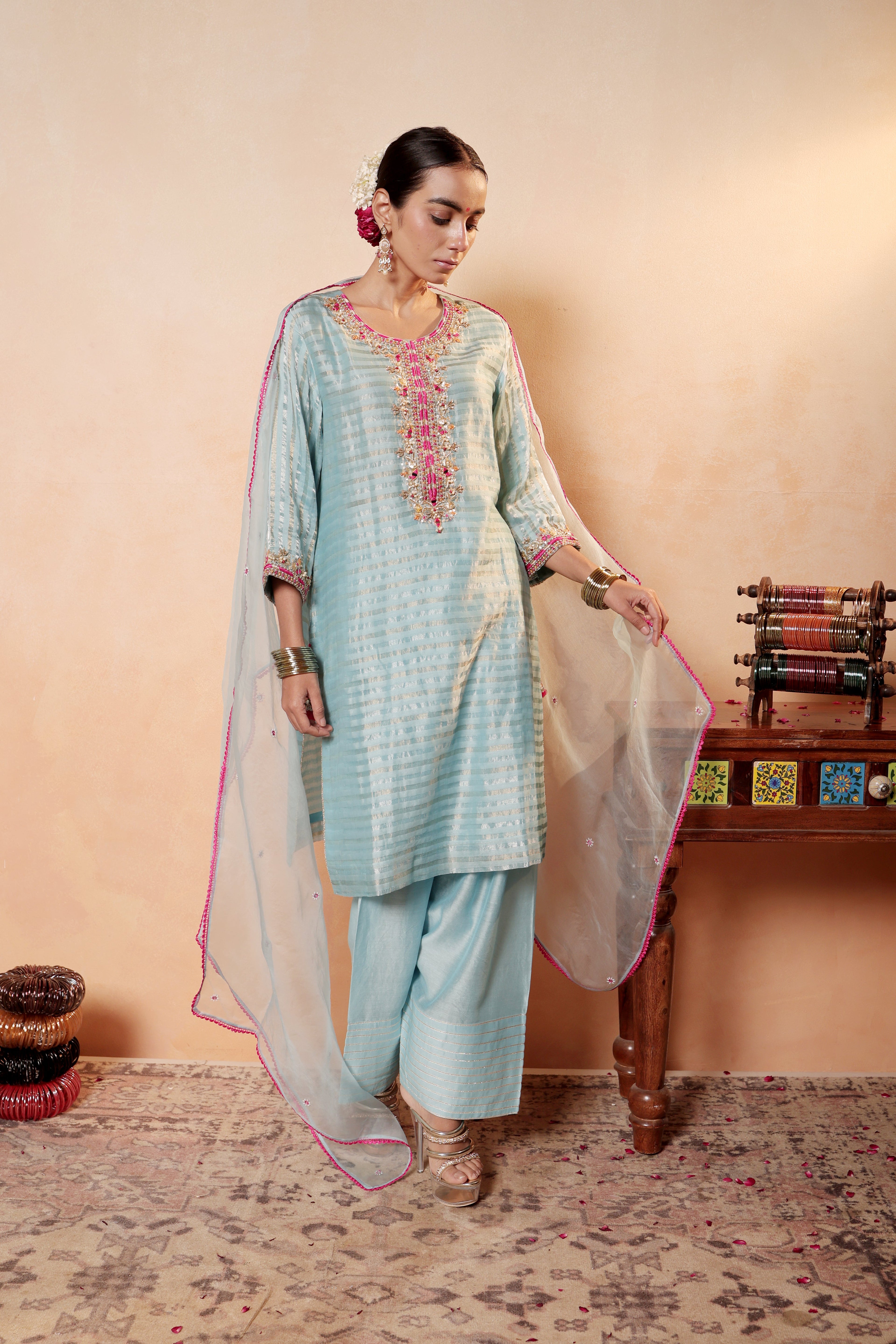 Model wearing sky blue silk striper tissue kurta with gota embroidery, styled with traditional farshi salwar and dupatta – Sunehri Gota Collection by House of AAS.