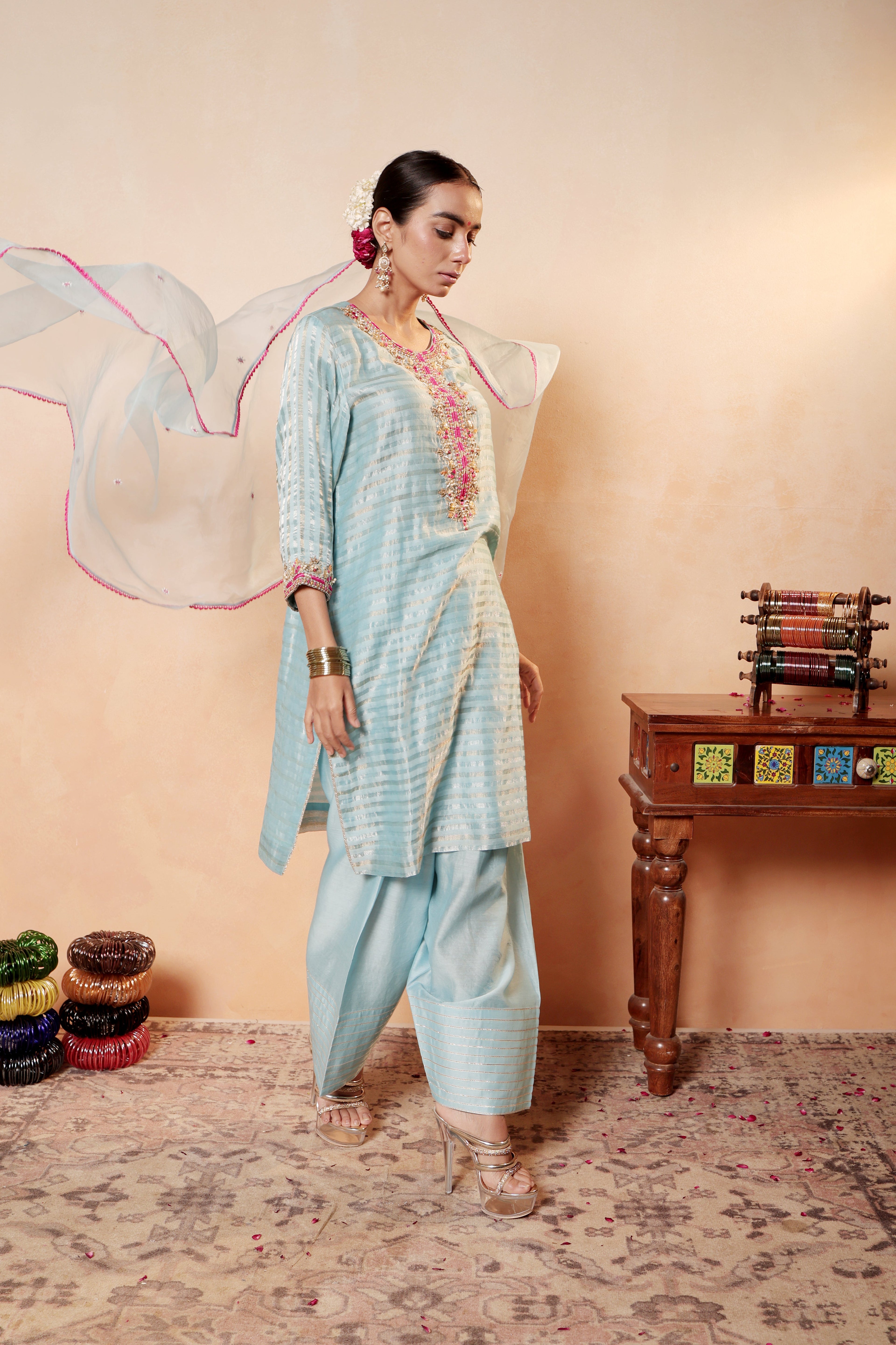 Model wearing sky blue silk striper tissue kurta with gota embroidery, styled with traditional farshi salwar and dupatta – Sunehri Gota Collection by House of AAS.