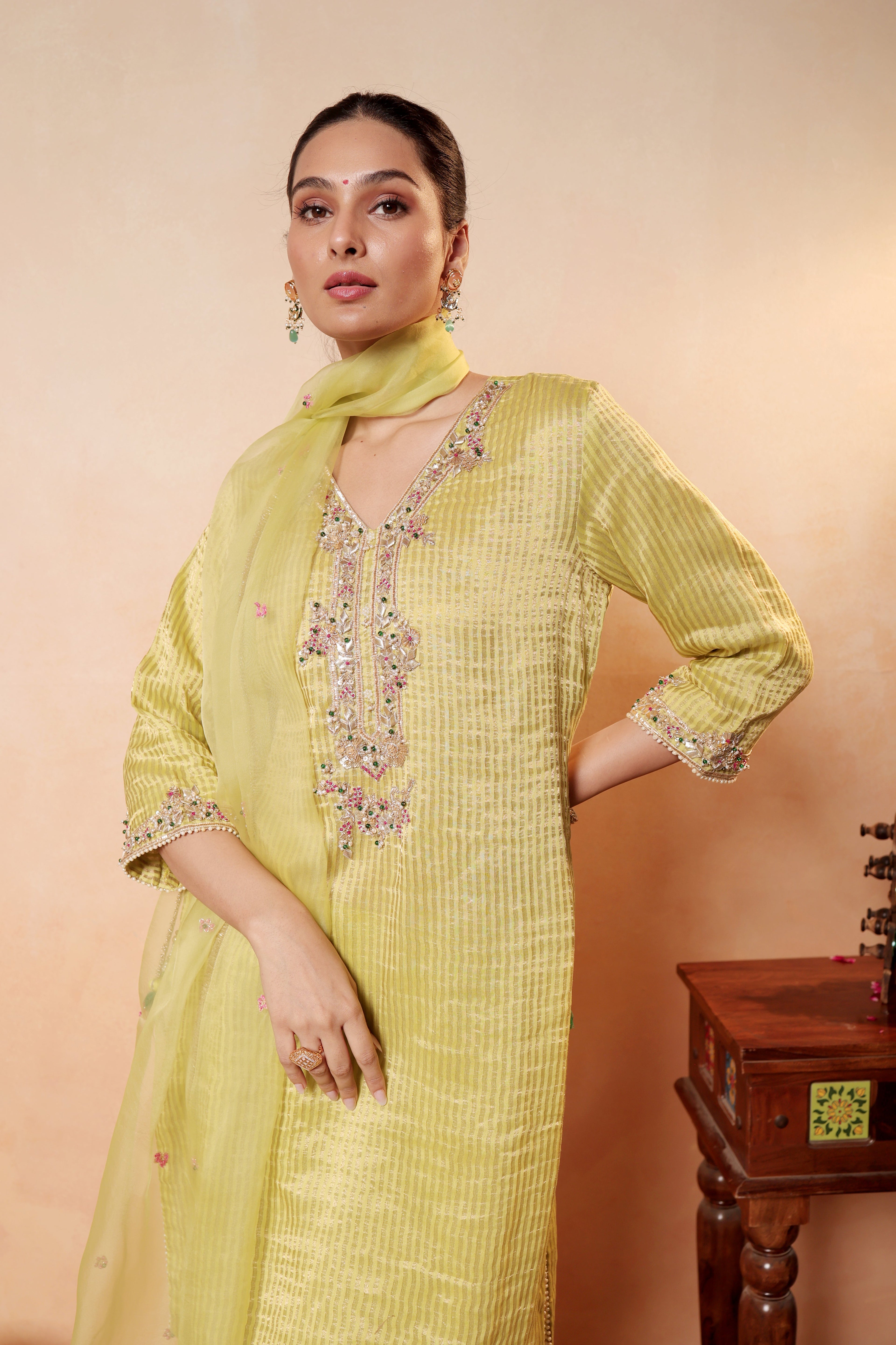 Model wearing lime yellow silk striper tissue kurta with gota embroidery, styled with traditional farshi salwar and dupatta – Sunehri Gota Collection by House of AAS.