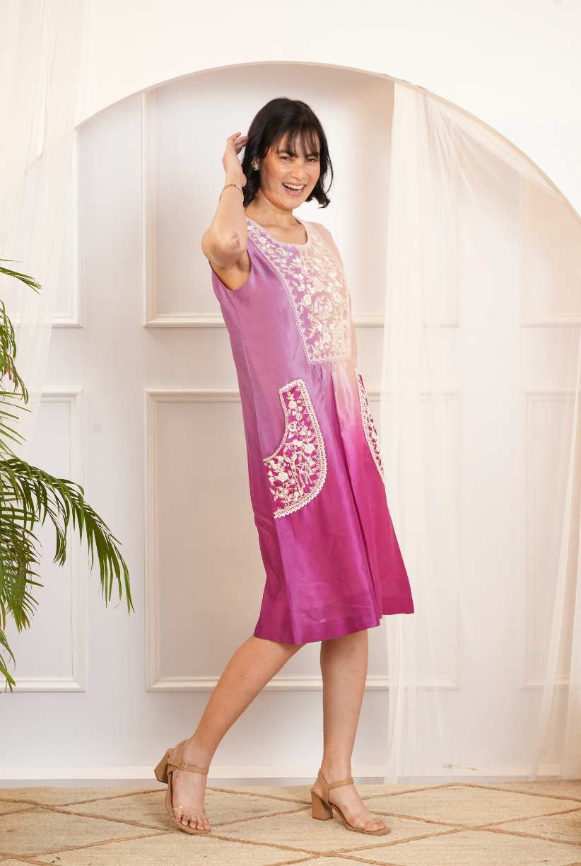Model wearing a pink & purple ombre silk chanderi sleeveless dress with off-white dori and bead embroidery — festive fusion outfit.