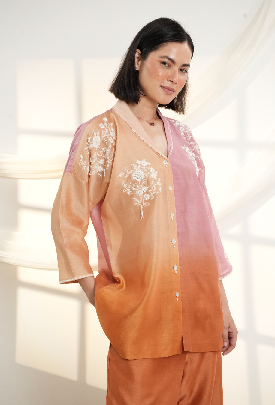 Model wearing a peach & rust ombre silk chanderi co-ord set with off-white dori and bead embroidery, styled with scalloped hem pants — festive outfit.