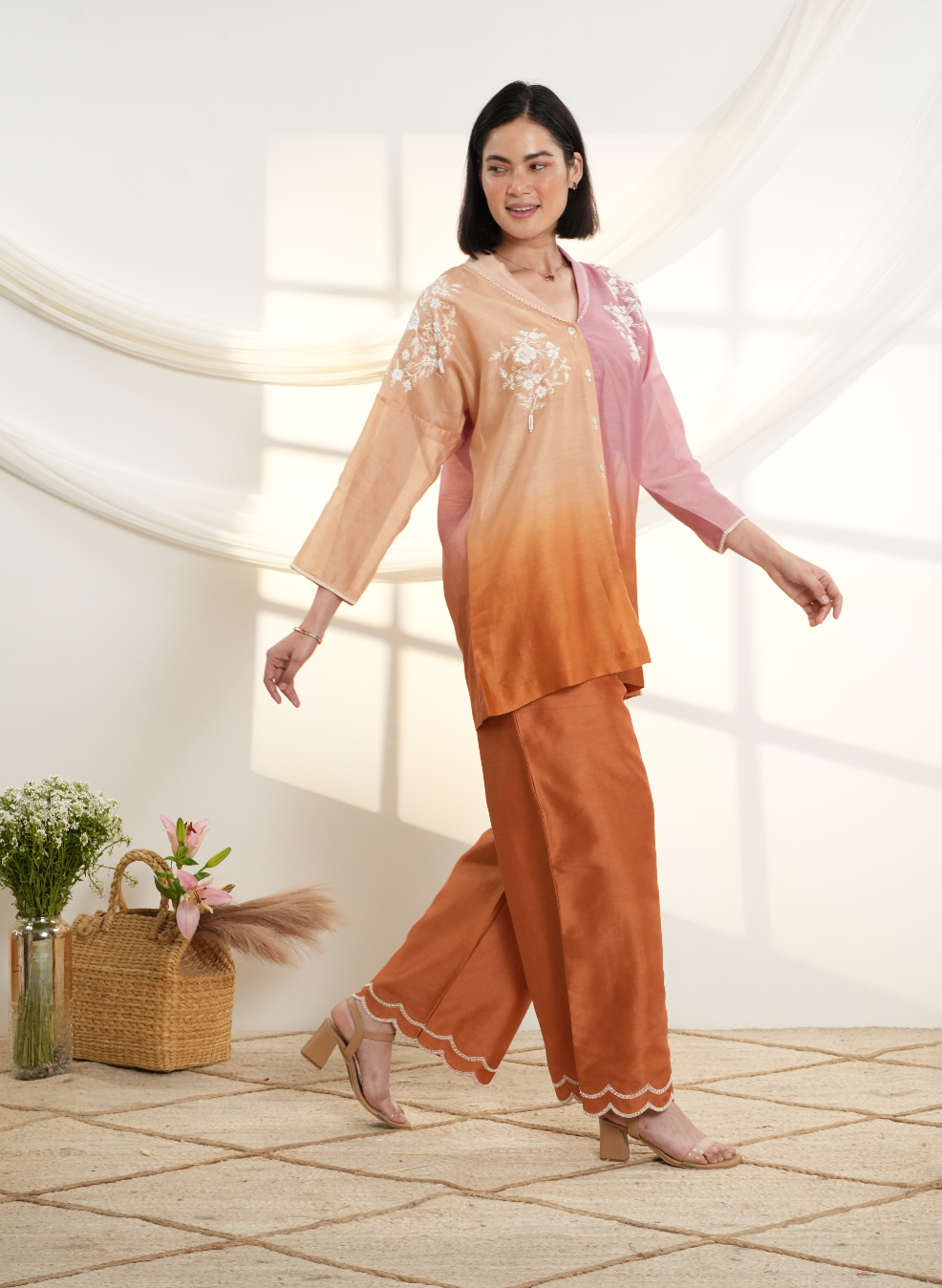 Model wearing a peach & rust ombre silk chanderi co-ord set with off-white dori and bead embroidery, styled with scalloped hem pants — festive outfit.