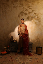 Antique gold silk tissue kurta set with intricate gota, resham, bead and dabka embroidery, paired with a red dupatta – festive women’s outfit