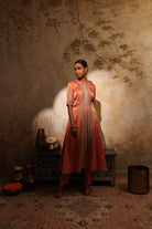 Coral pink silk tissue jacket-style kurta set with embroidery and pants, festive wedding wear.