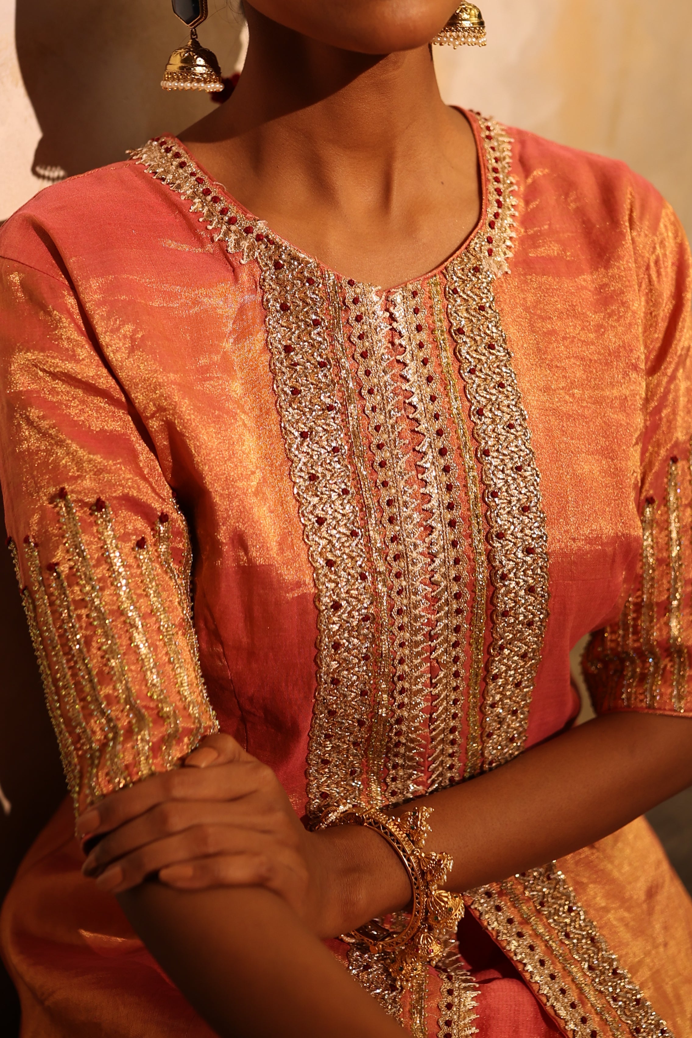 Elegant coral pink silk tissue embroidered kurta jacket set for weddings and celebrations.