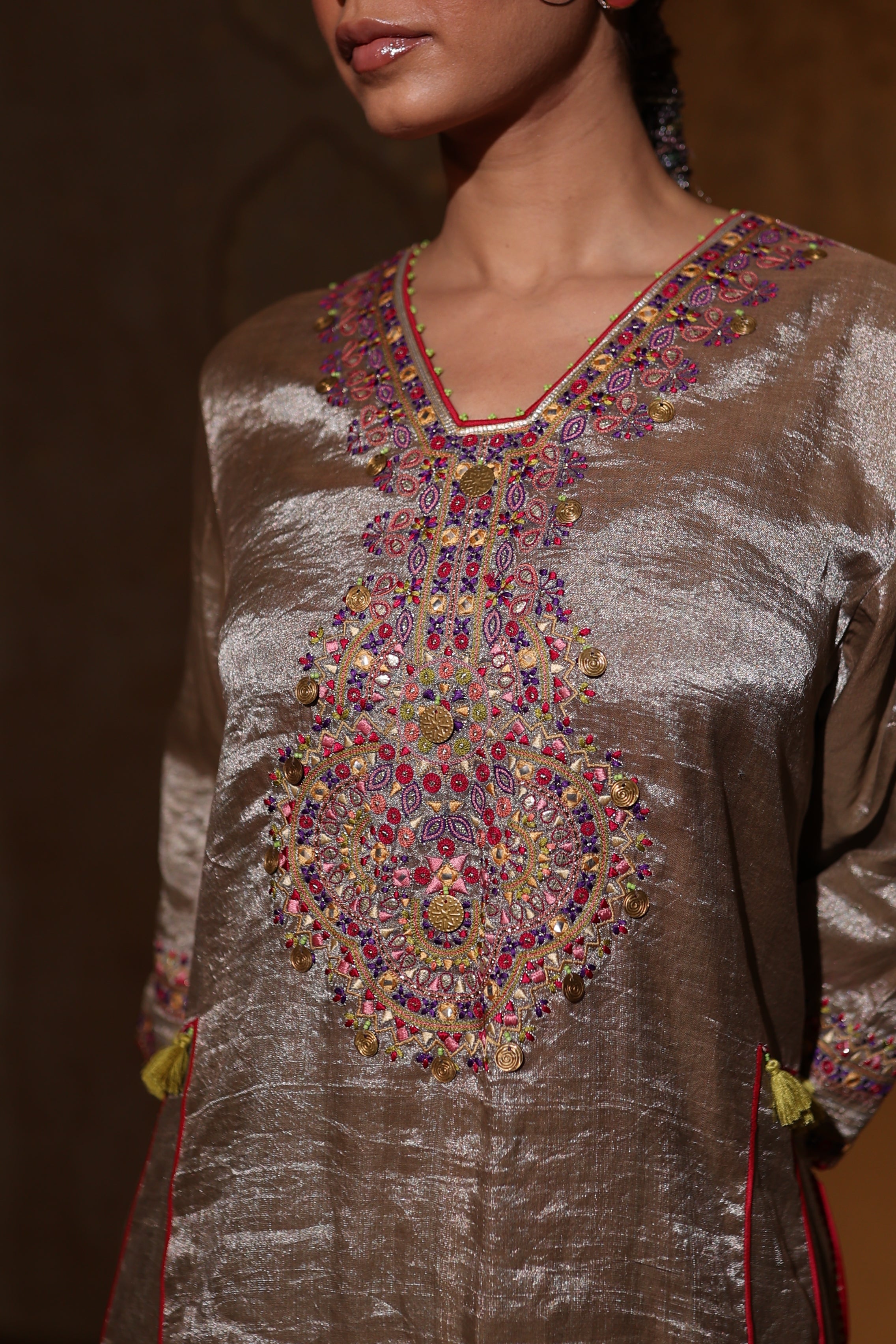 Close-up of hand-embroidered antique silver kurta in tissue fabric