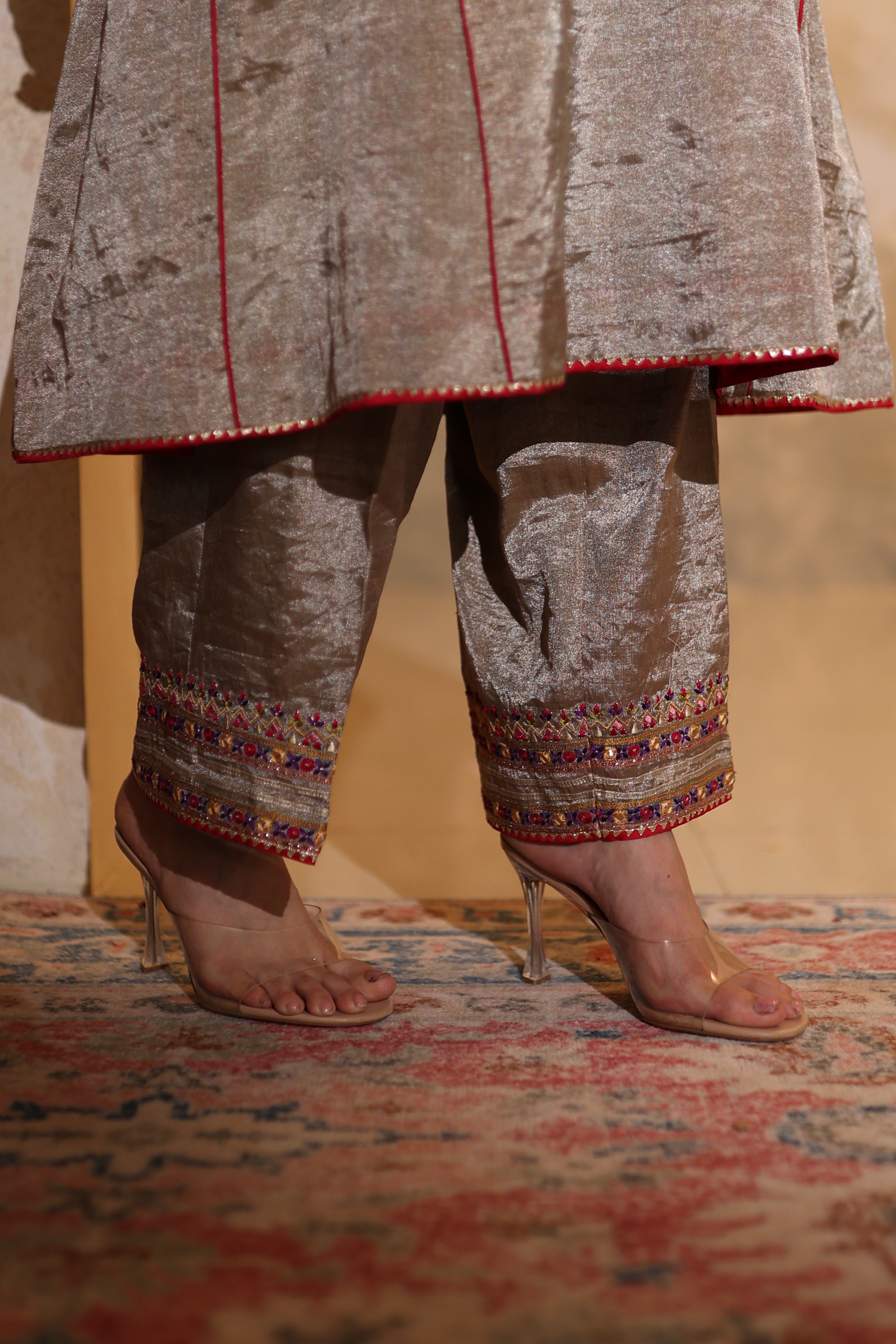 Close-up of hand-embroidered antique silver kurta in tissue fabric