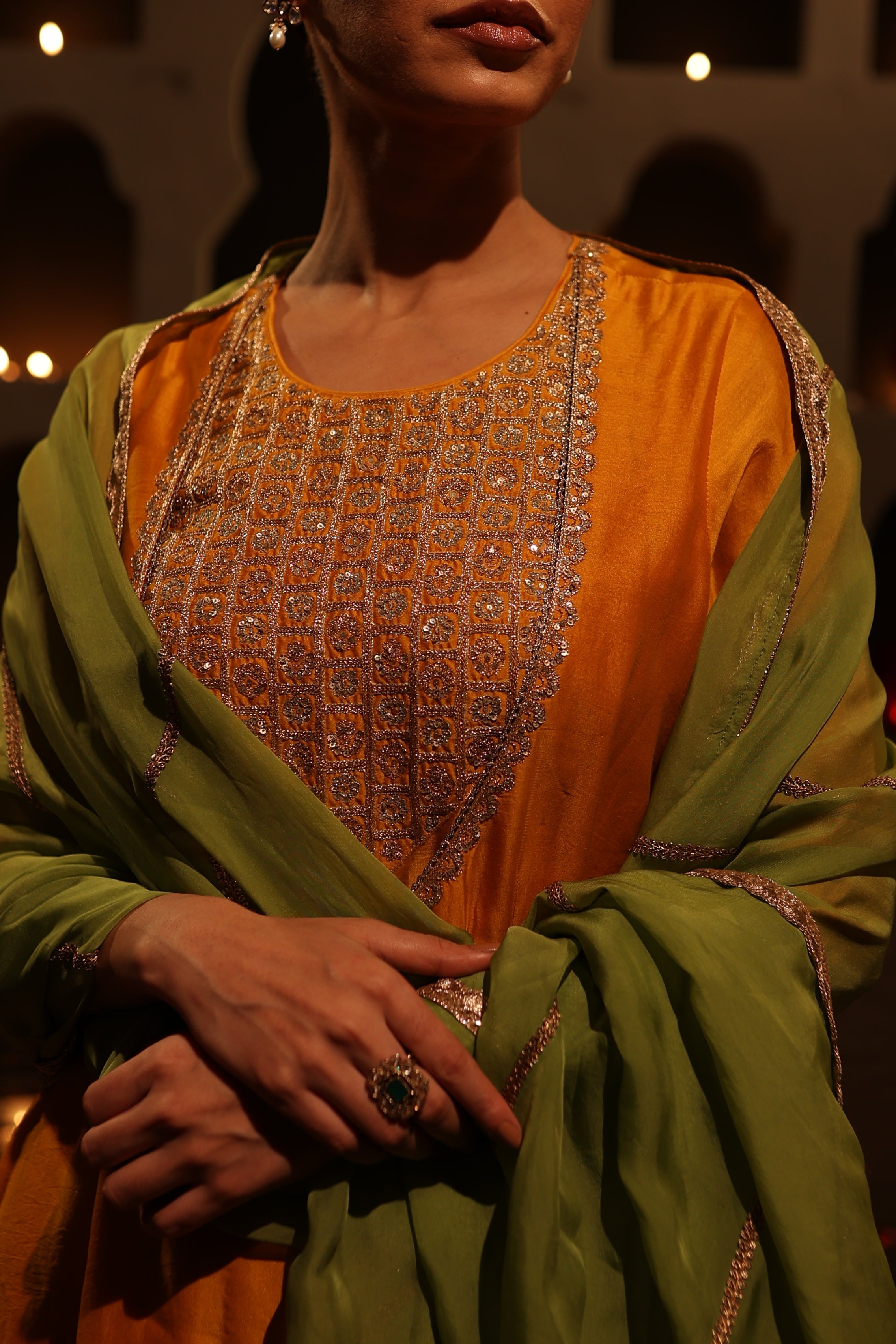Close-up of Model wearing mustard yellow Chanderi suit with aari tari embroidery – Moseequi collection, House of AAS 