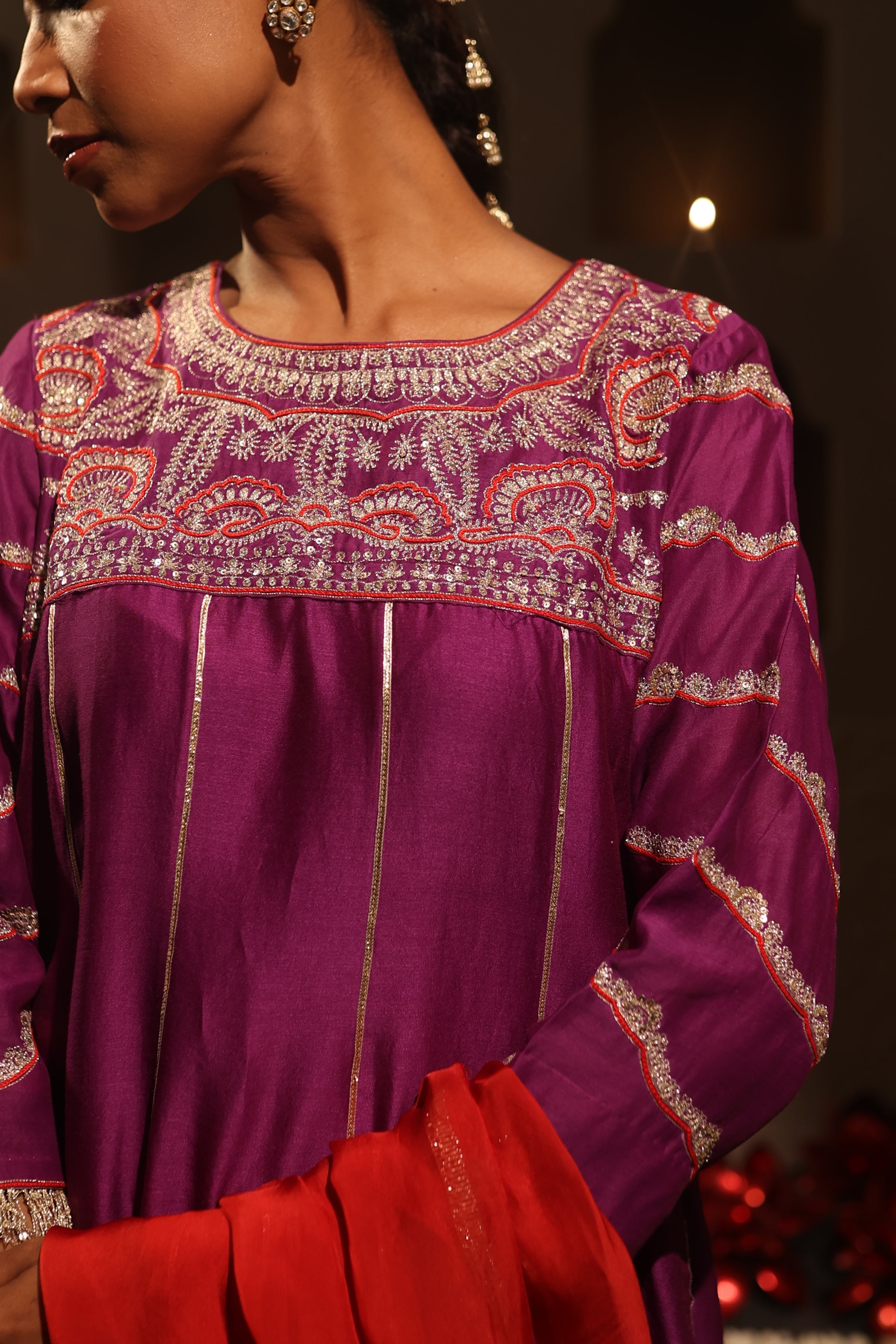Close-up of purple Chanderi suit with intricate aari tari embroidery, red dupatta, and bottoms from Moseequi Collection by House of AAS – festive and wedding wear.
