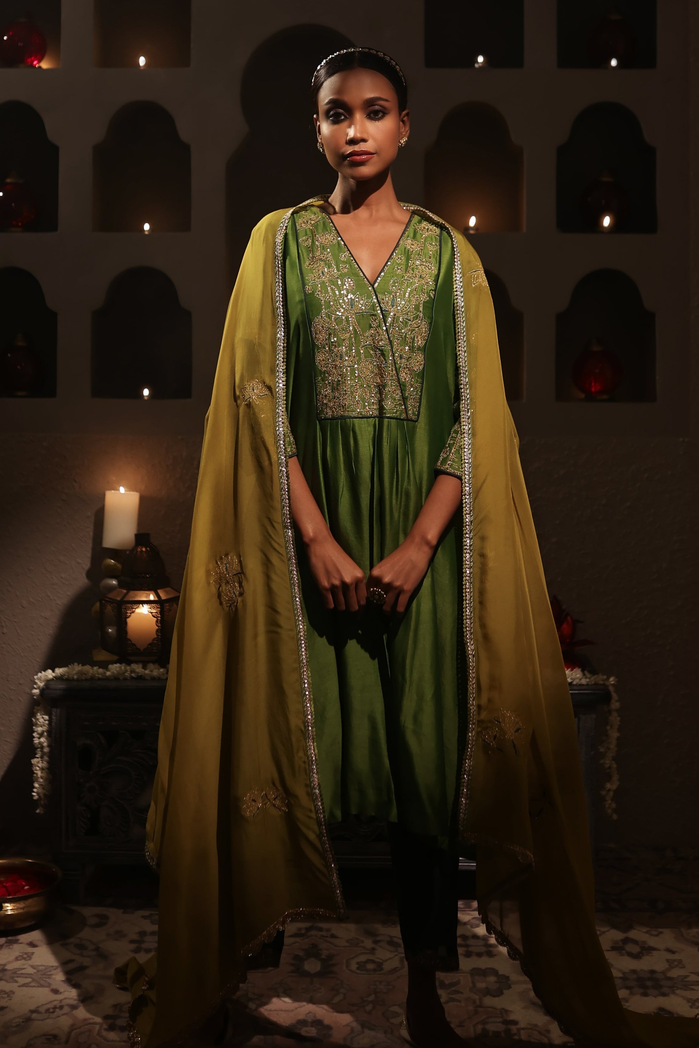 Model wearing a green silk chanderi kurta set with mustard dupatta and zari hand embroidery — festive and wedding outfit.