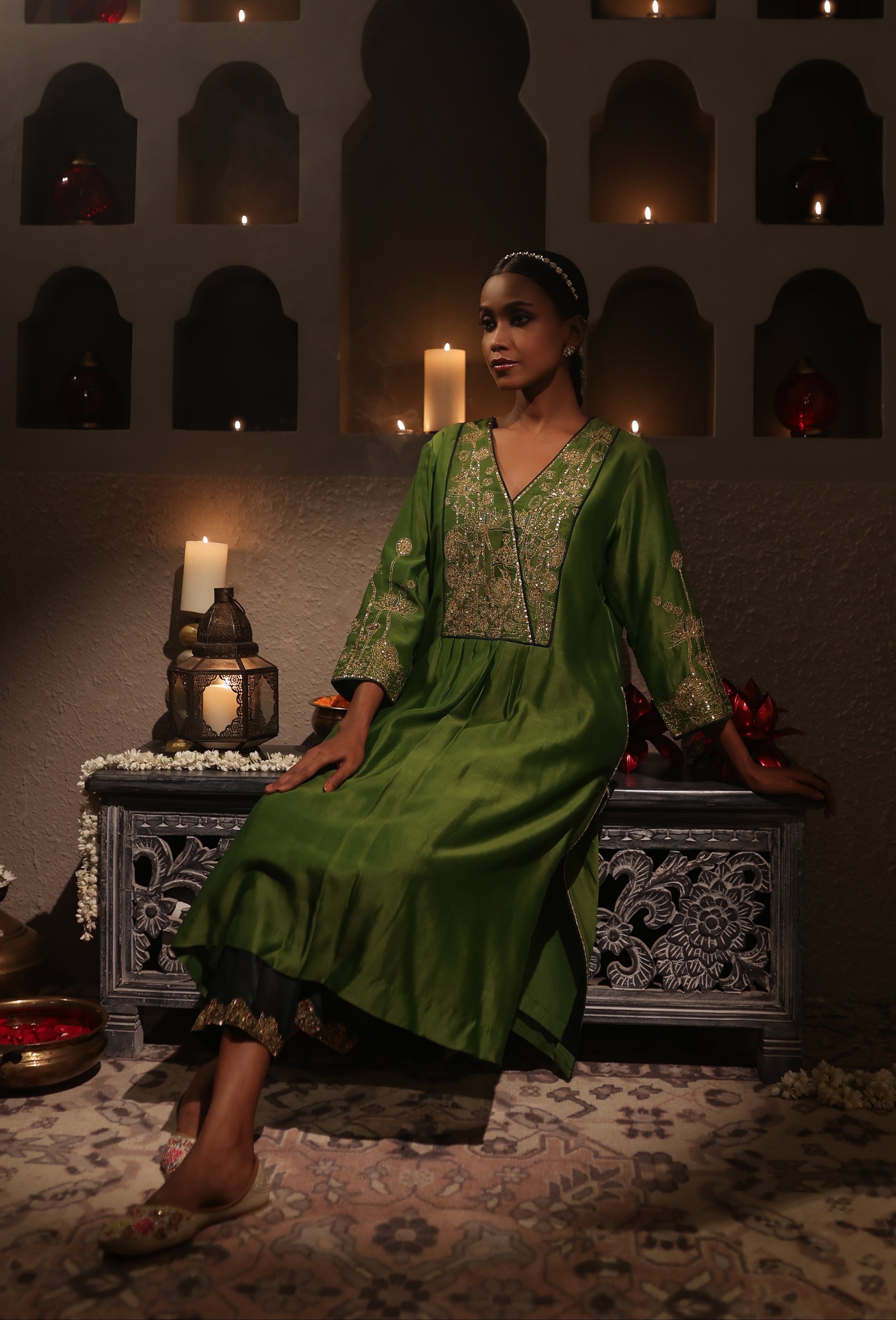 Model wearing a green silk chanderi kurta set with mustard dupatta and zari hand embroidery — festive and wedding outfit.
