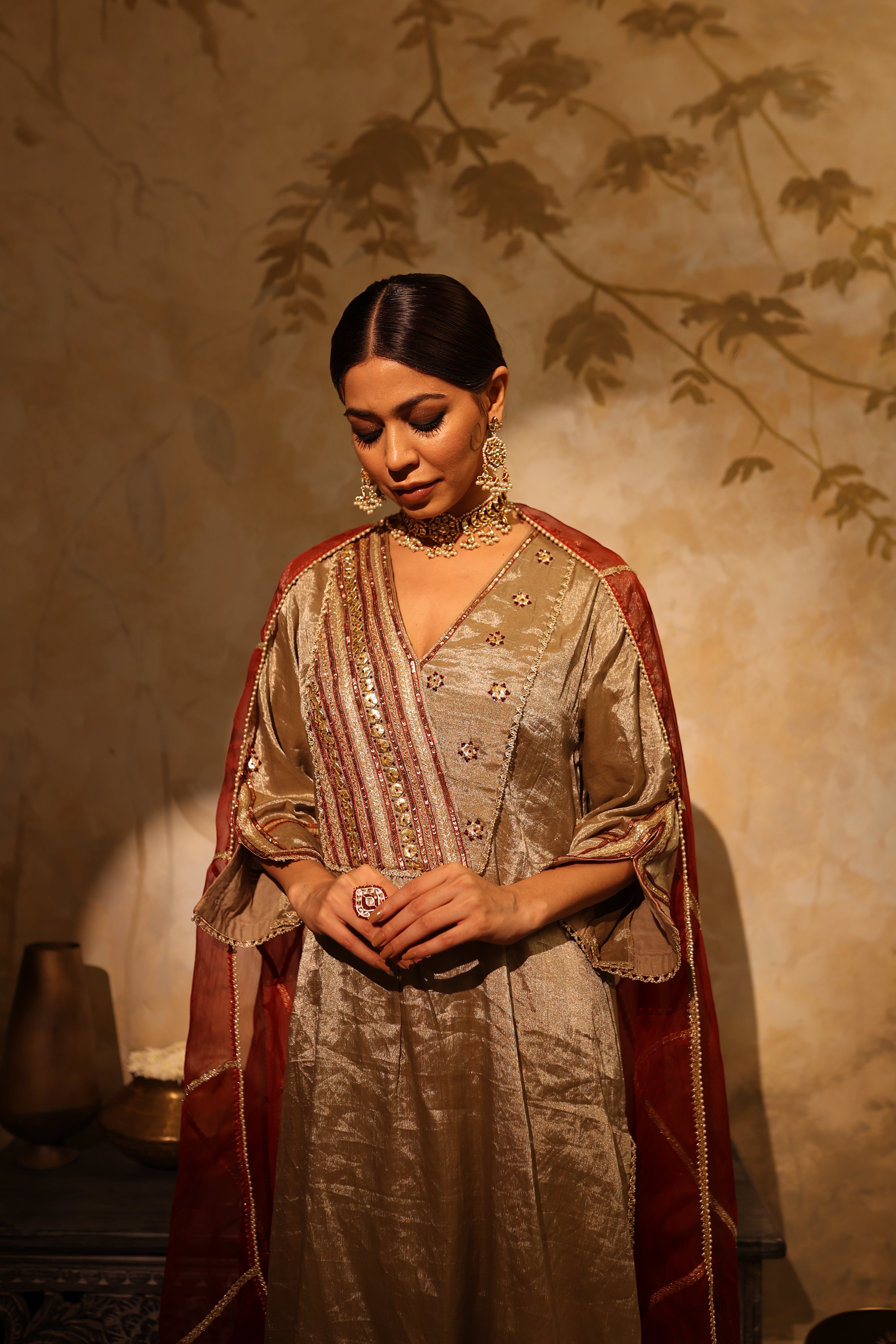 Antique silver silk tissue kurta set with intricate gota, sequin, dabka and resham embroidery, paired with dupatta – timeless festive outfit.
