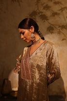 Antique silver silk tissue kurta set with intricate gota, sequin, dabka and resham embroidery, paired with dupatta – timeless festive outfit.