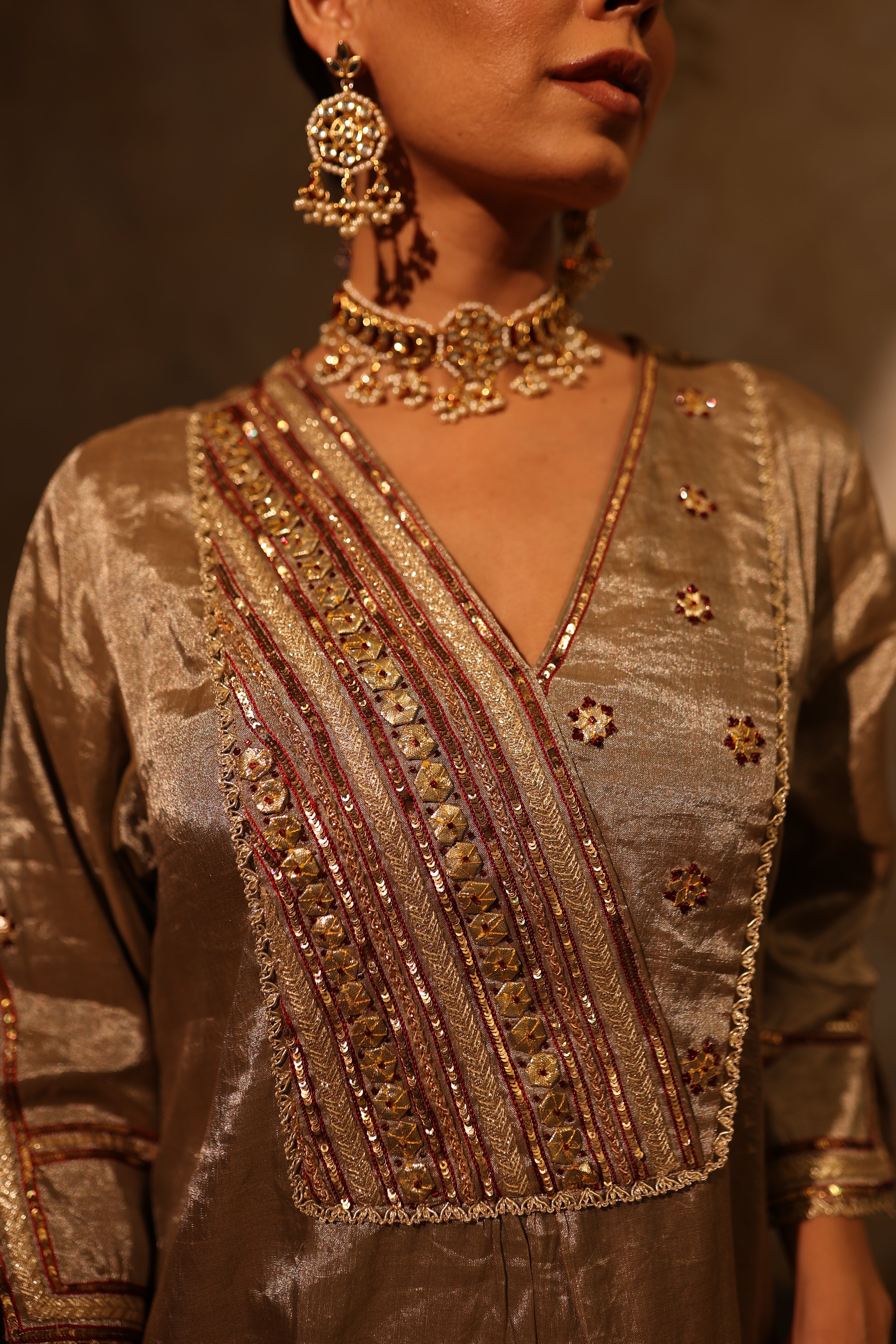 Antique silver silk tissue kurta set with intricate gota, sequin, dabka and resham embroidery, paired with dupatta – timeless festive outfit.