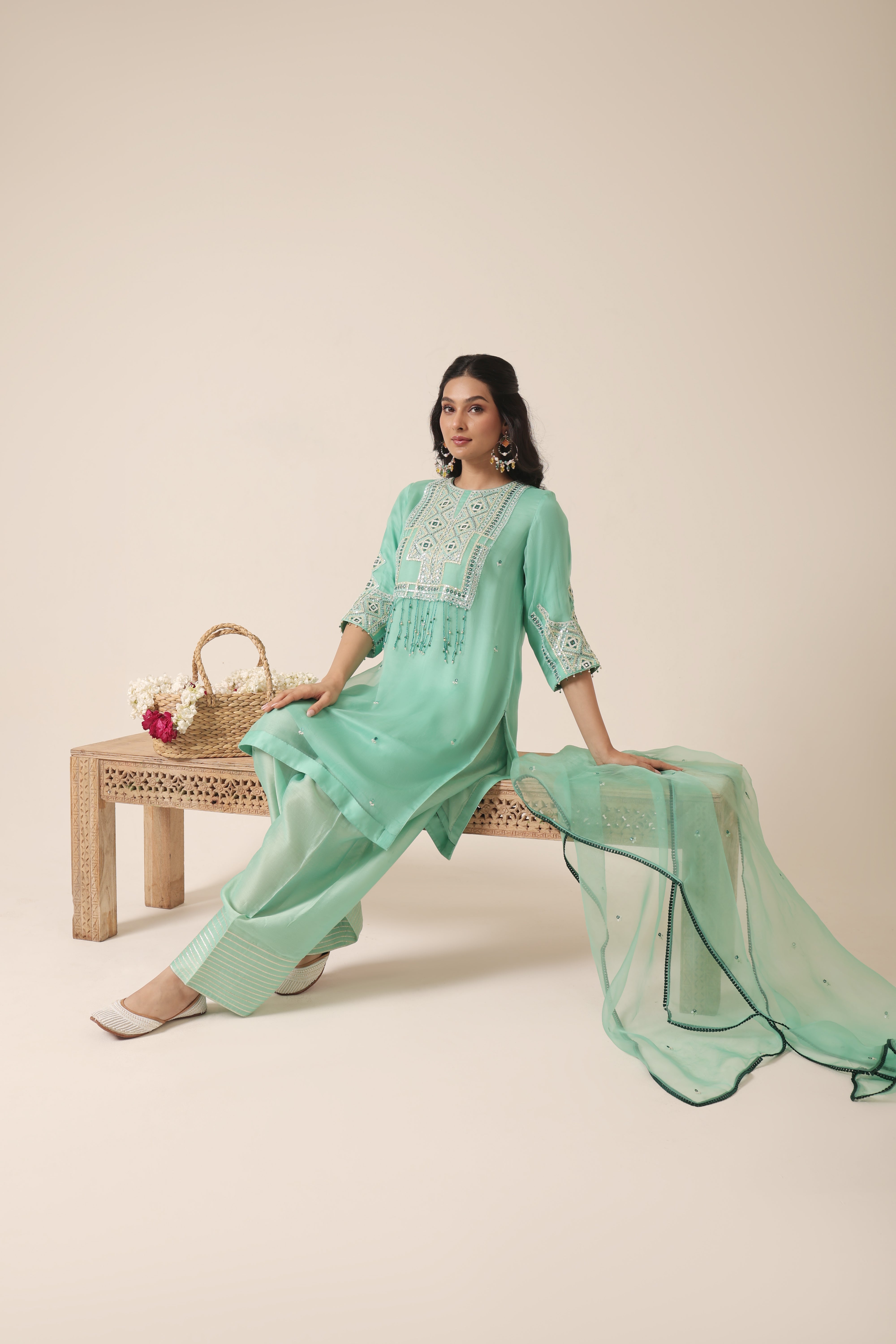 Model wearing mint green silk organza kurta with mirror embroidery, paired with farshi salwar and organza dupatta – Jhilmil Collection by House of AAS.