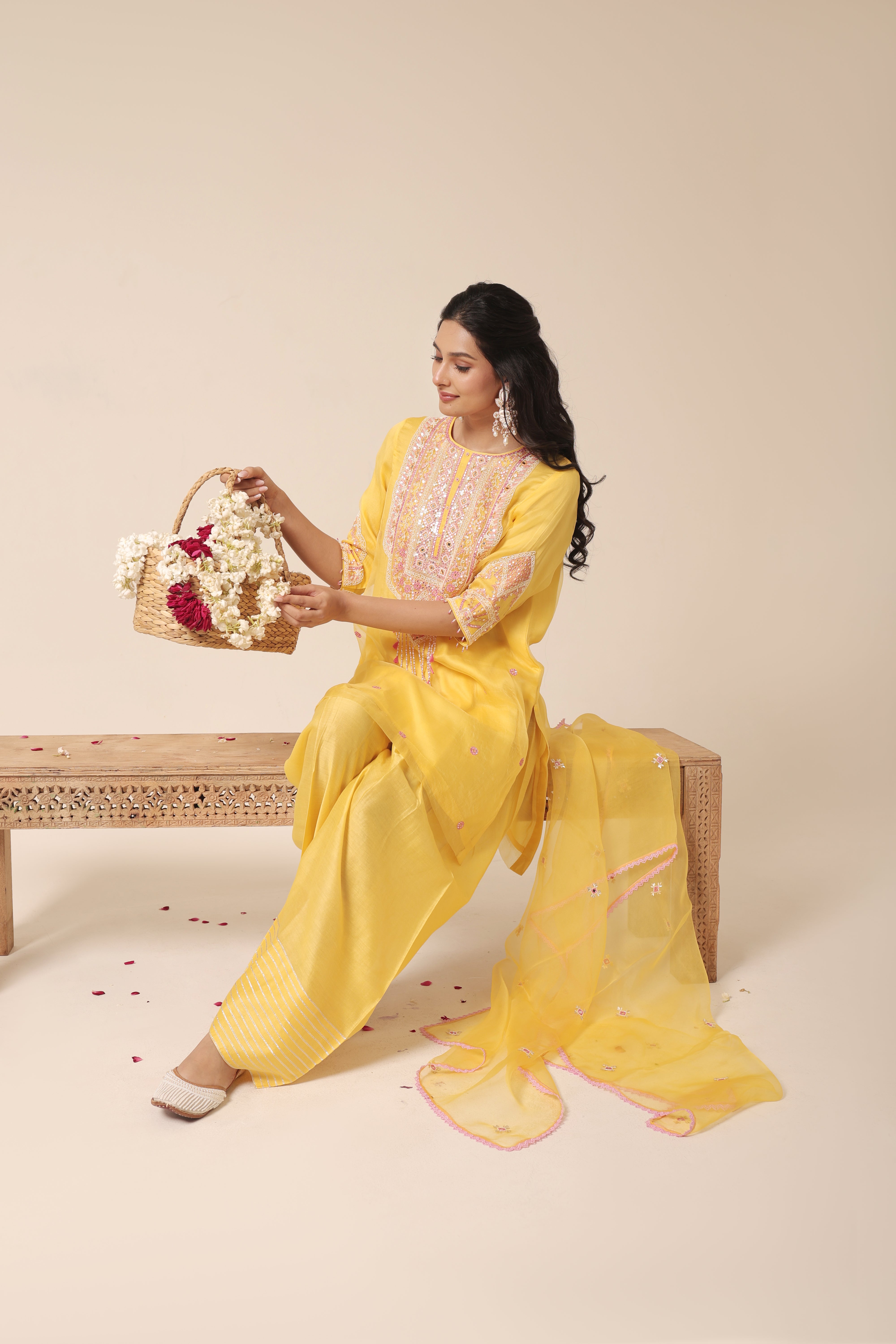 Model wearing yellow silk organza kurta set with mirror embroidery and farshi salwar – Jhilmil Collection House of AAS.