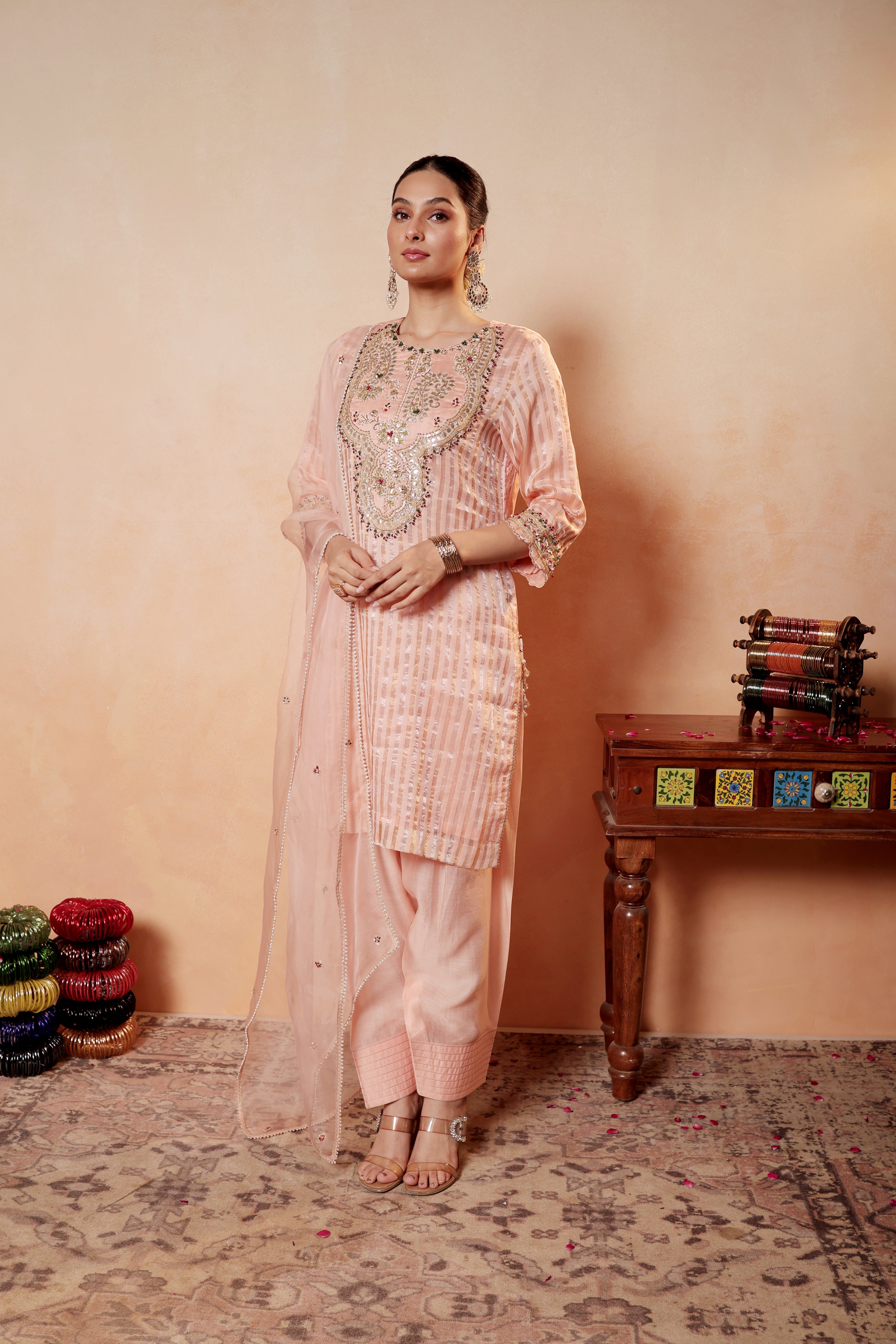 Model wearing peach Tissue Silk Chanderi kurta with gota embroidery, paired with regal farshi salwar and dupatta – Sunehri Gota Collection by House of AAS.