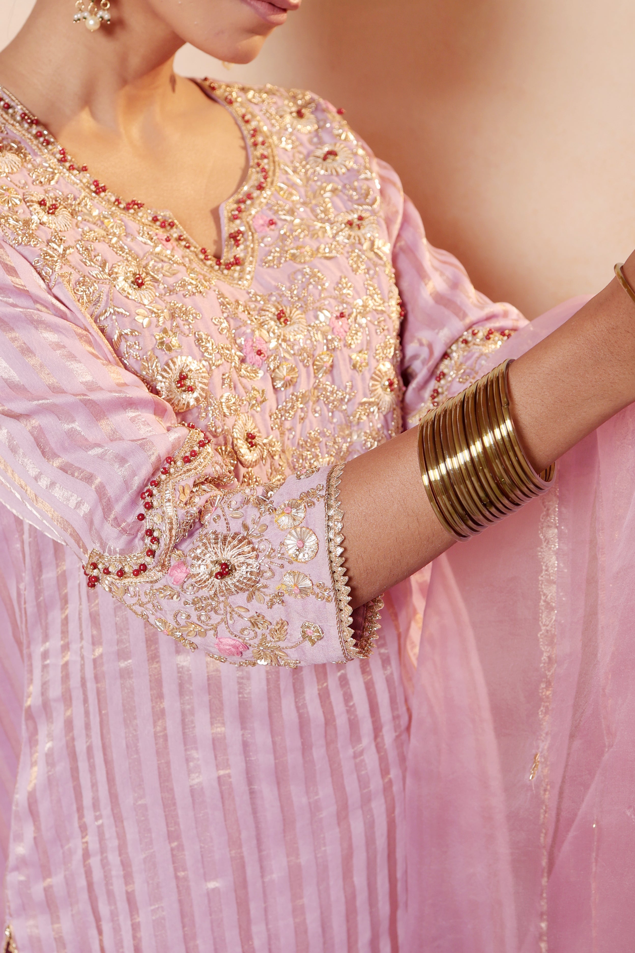 Model wearing lavender tissue silk kurta with intricate gota embroidery, paired with regal farshi salwar and dupatta – Sunehri Gota Collection by House of AAS.