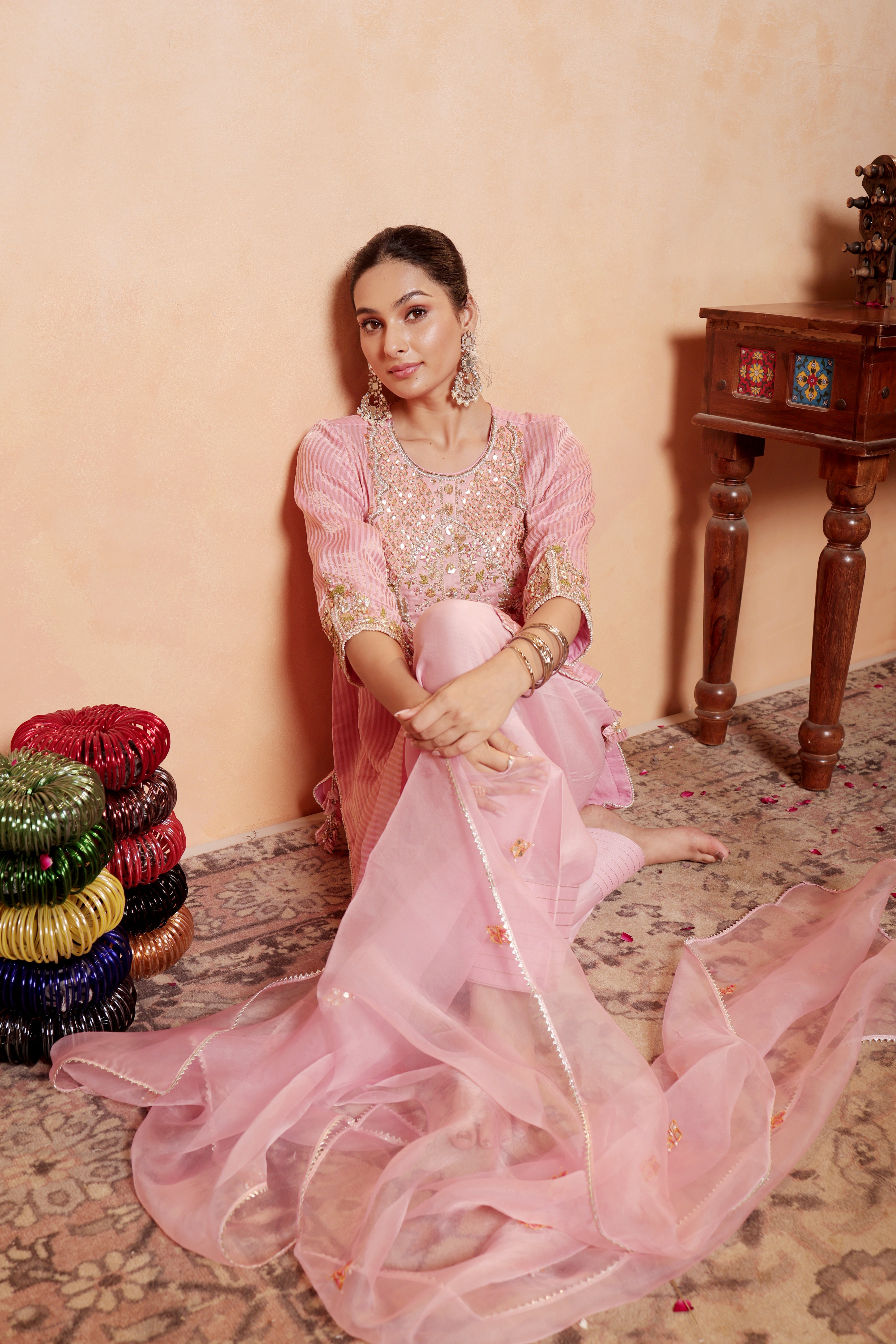 Model wearing pink tissue silk kurta with intricate gota embroidery, paired with regal farshi salwar and dupatta – Sunehri Gota Collection by House of AAS.