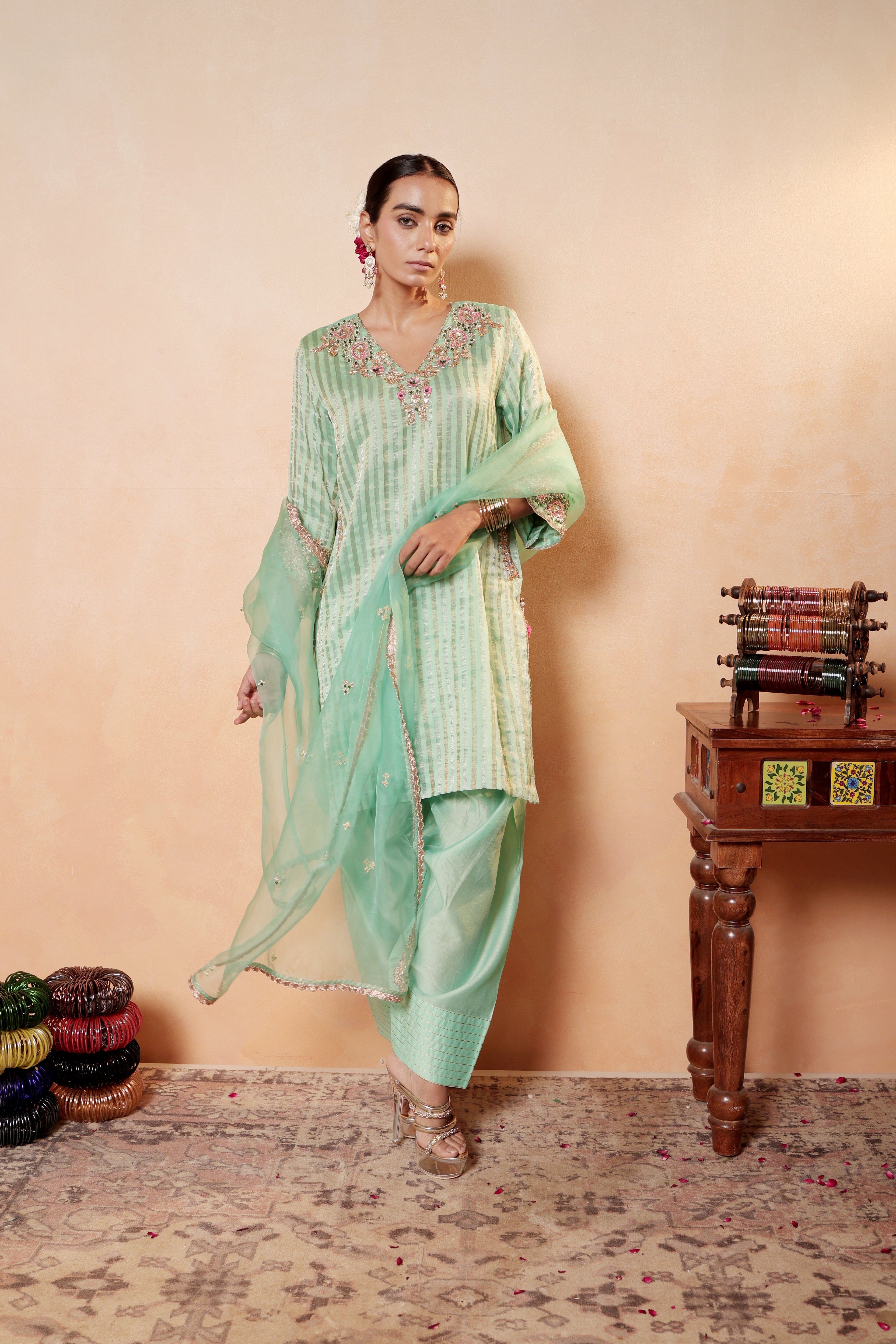 Model wearing mint green silk striper tissue kurta with intricate gota embroidery, paired with regal farshi salwar and dupatta – Sunehri Gota Collection by House of AAS.