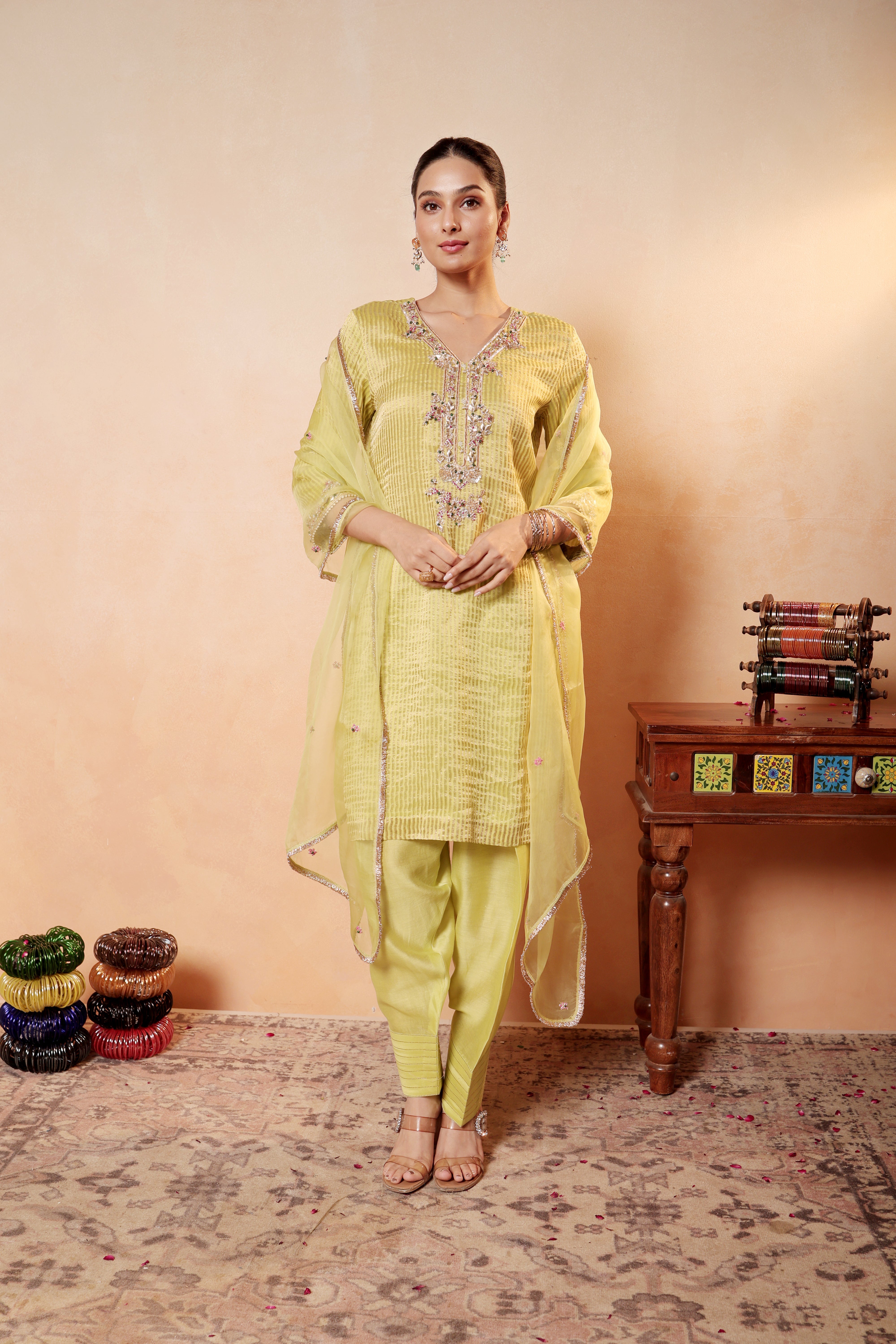 Model wearing lime yellow silk striper tissue kurta with gota embroidery, styled with traditional farshi salwar and dupatta – Sunehri Gota Collection by House of AAS.