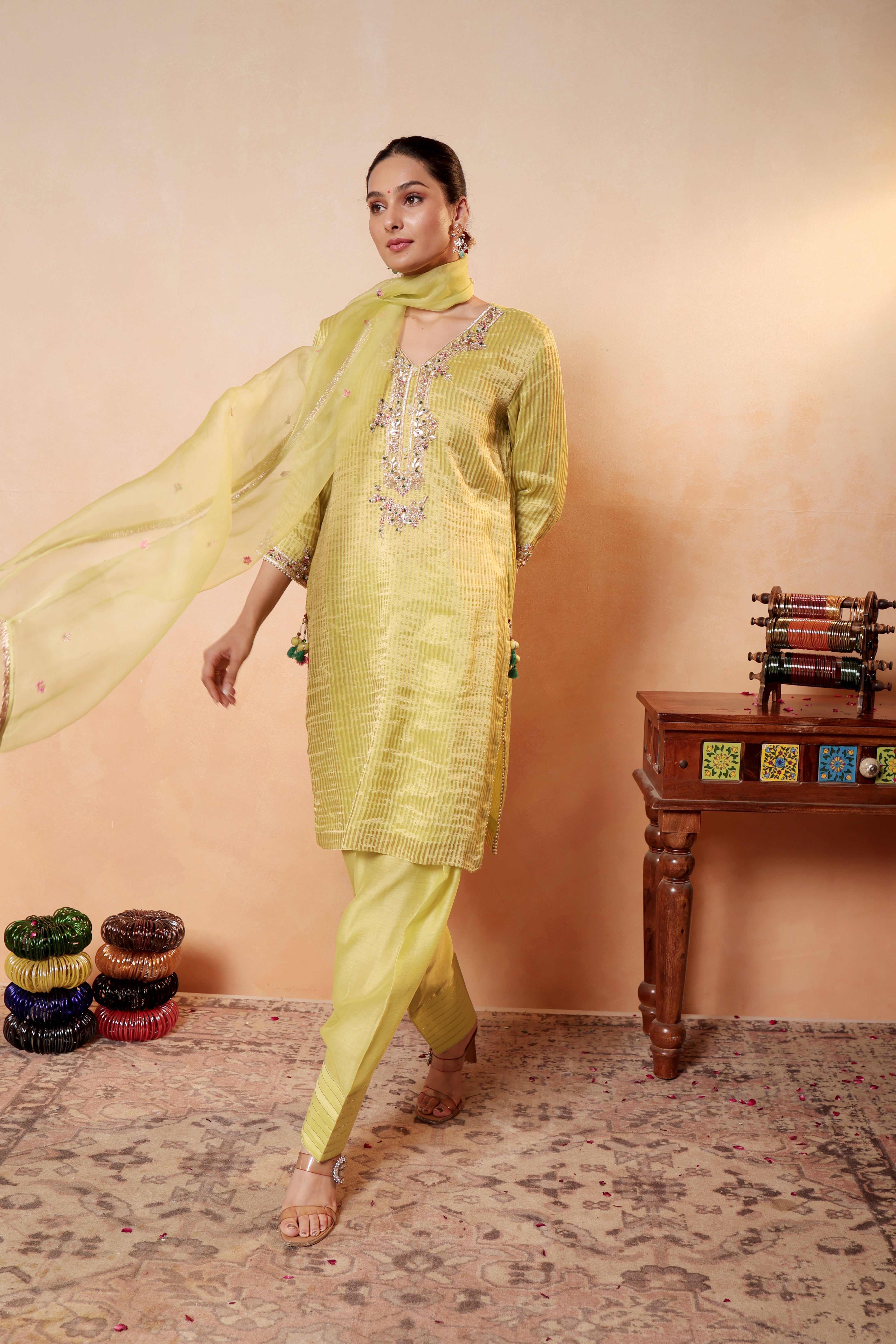 Model wearing lime yellow silk striper tissue kurta with gota embroidery, styled with traditional farshi salwar and dupatta – Sunehri Gota Collection by House of AAS.