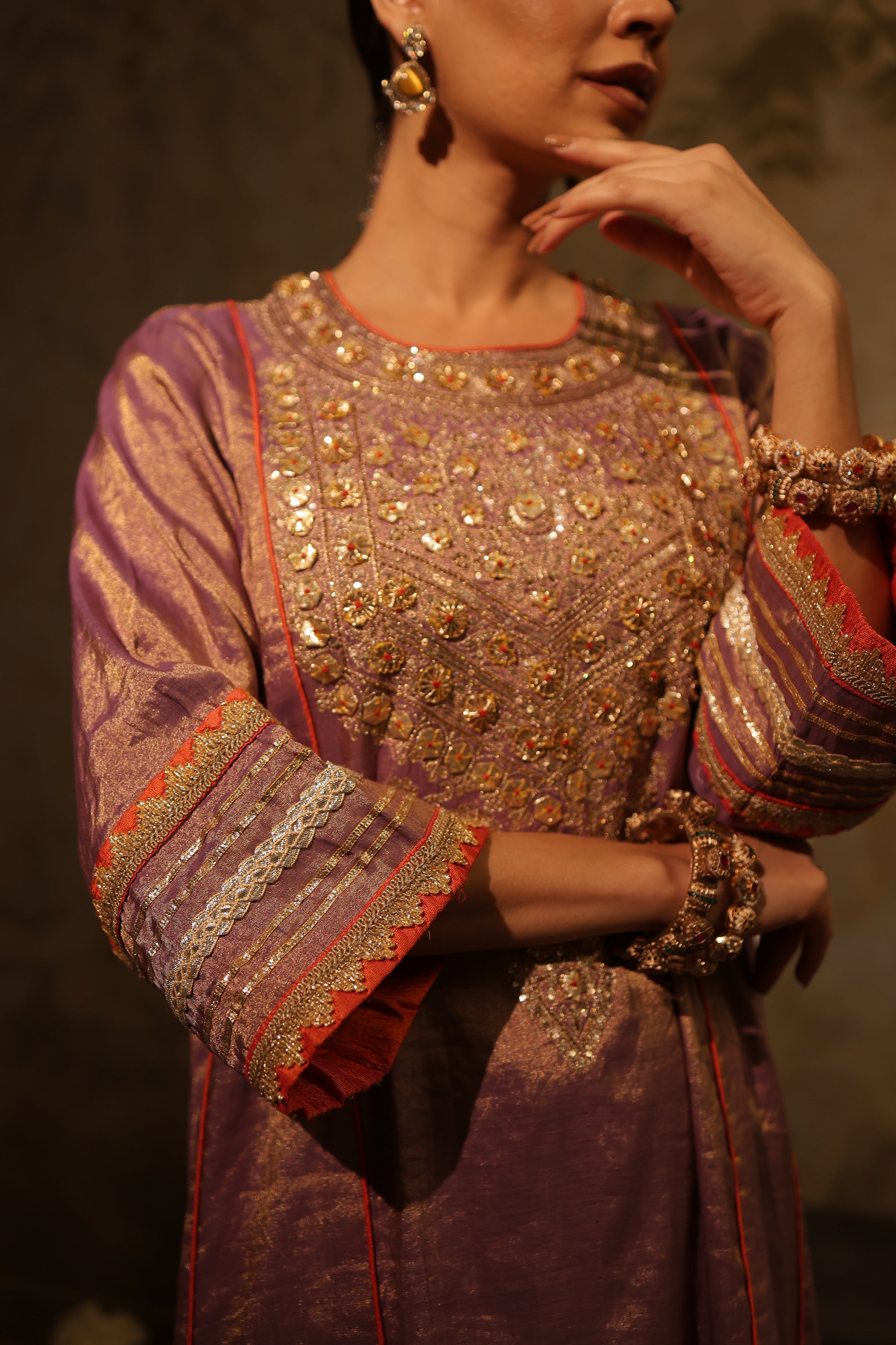 Mauve silk tissue kurta set with hand embroidery and organza dupatta, perfect festive wear.
