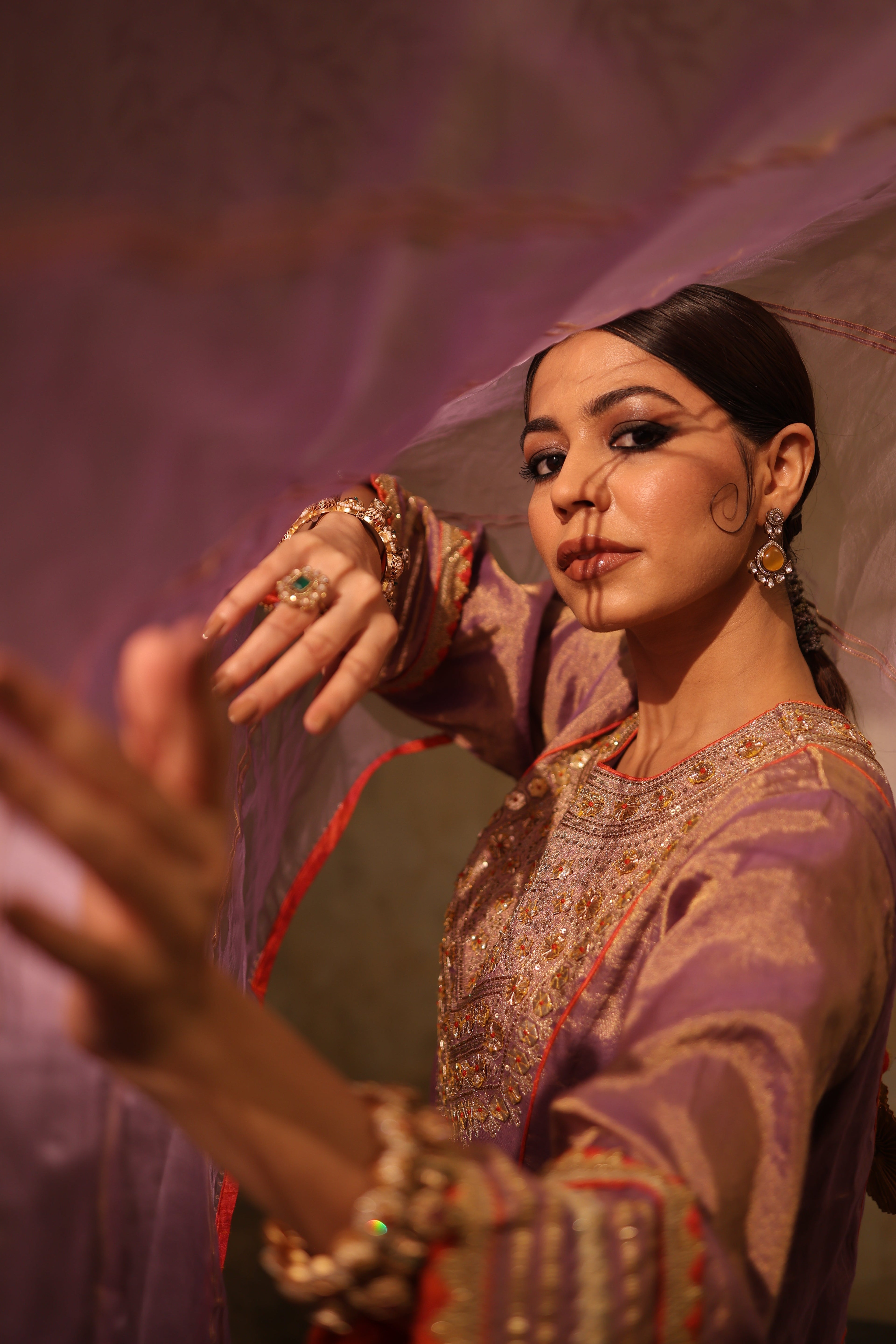 Mauve silk tissue kurta set with hand embroidery and organza dupatta, perfect festive wear.