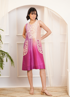 Model wearing a pink & purple ombre silk chanderi sleeveless dress with off-white dori and bead embroidery — festive fusion outfit.