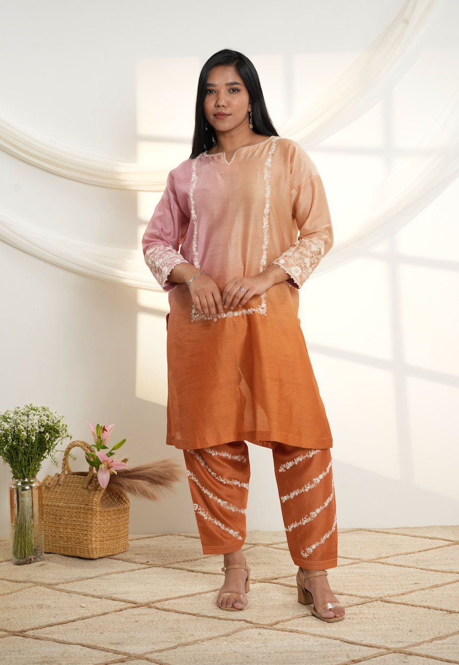 Model wearing a peach & rust ombre silk chanderi kurta set with off-white dori and bead embroidery, styled with striped embroidered salwar.