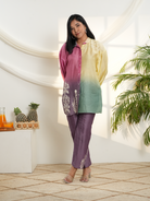 Model wearing a yellow, pink & green ombre silk chanderi co-ord set with purple pants and off-white dori bead embroidery — festive ethnic outfit.