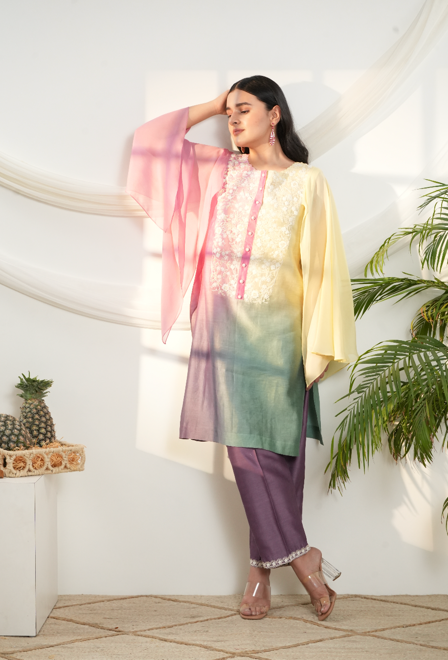 Model wearing a multicolor ombre silk chanderi kurta set in pastel yellow, pink & green with purple pants and off-white dori bead embroidery.